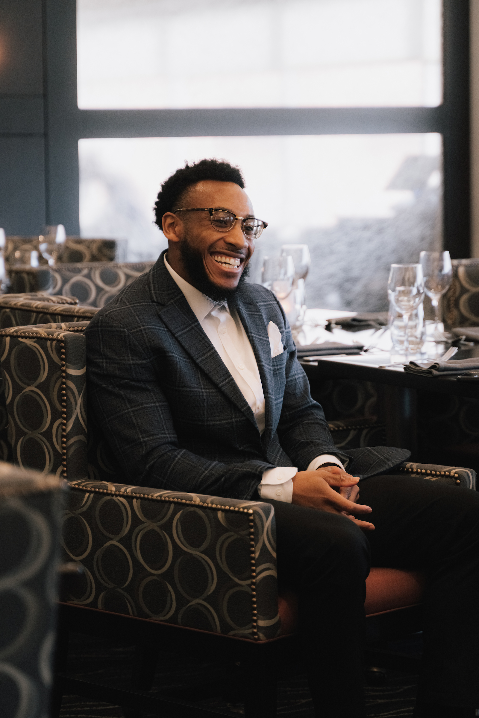 Man seated at a private event