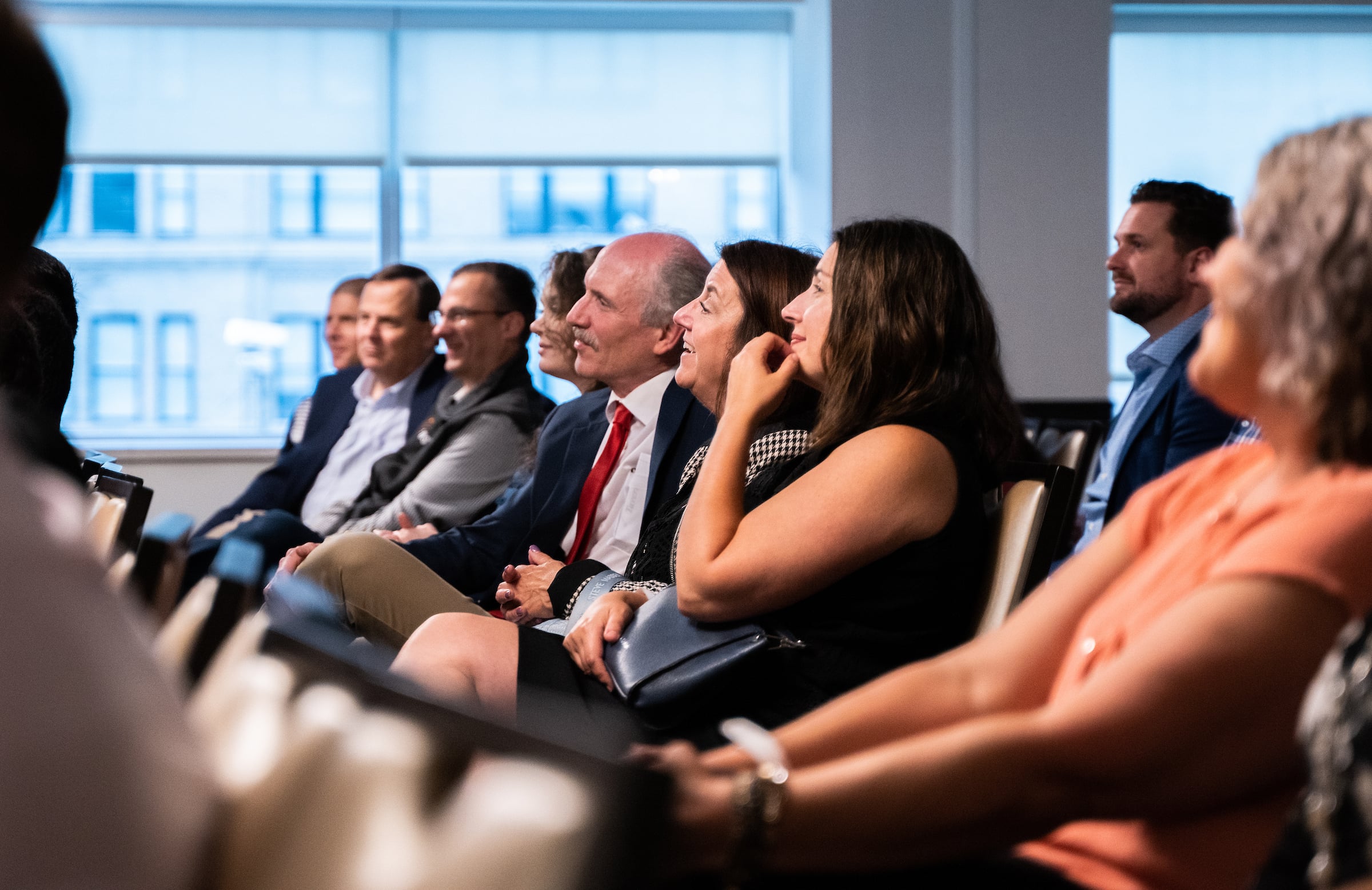 Row of seated people at a meeting