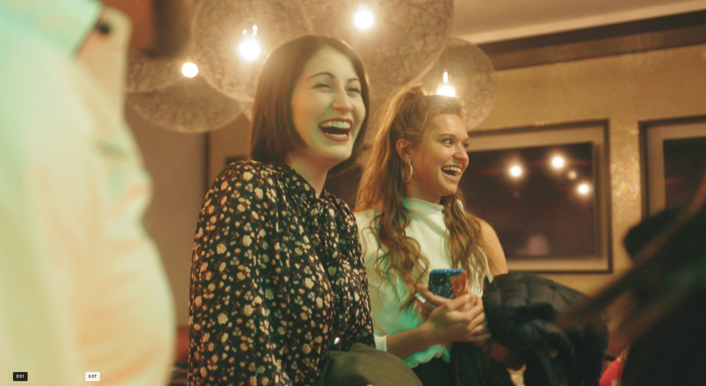 Two Women smiling at a private event