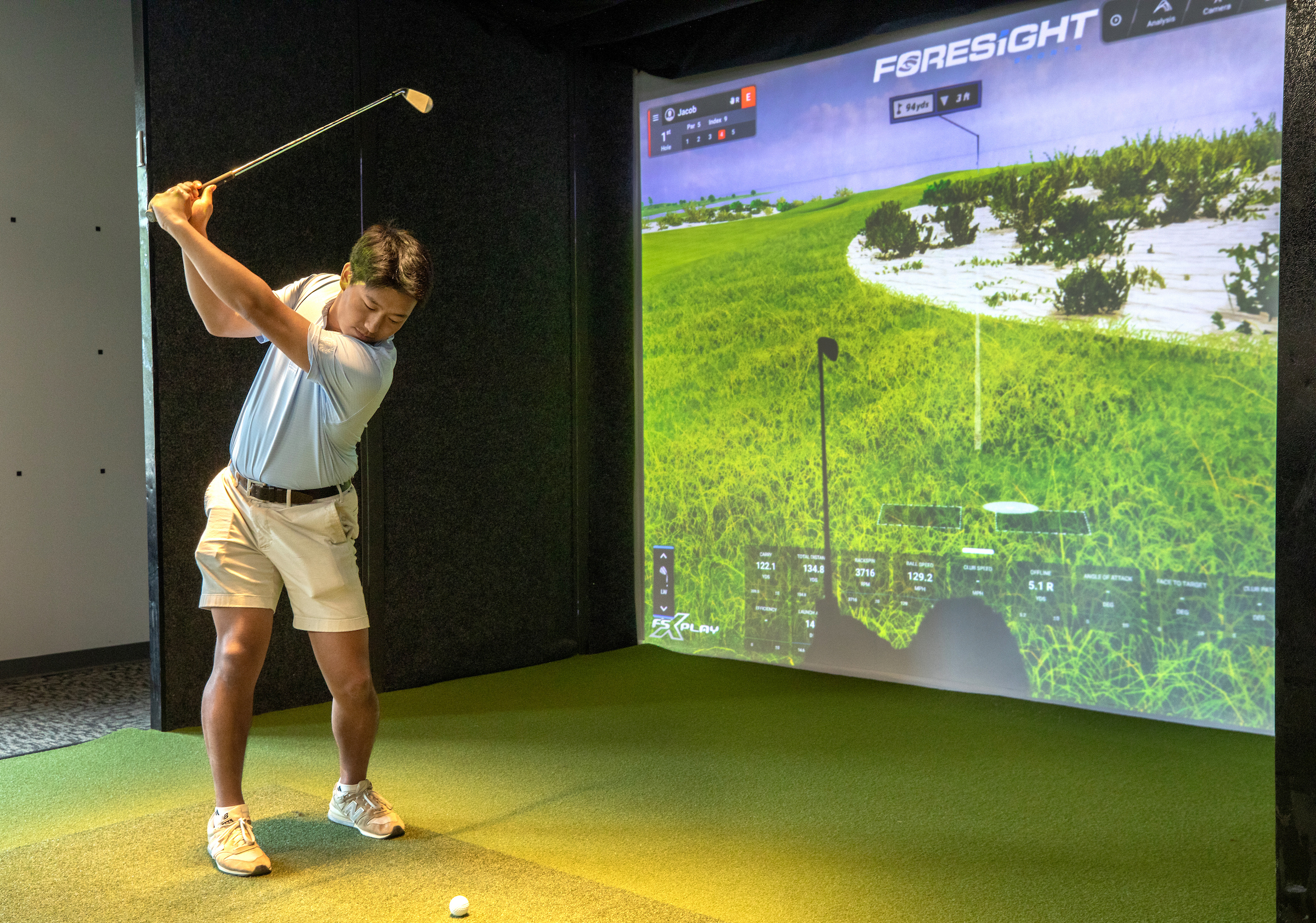 golf Simulator with a man swinging