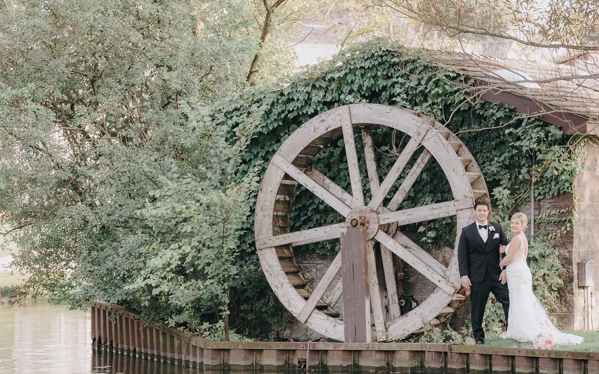 Couple by water wheel
