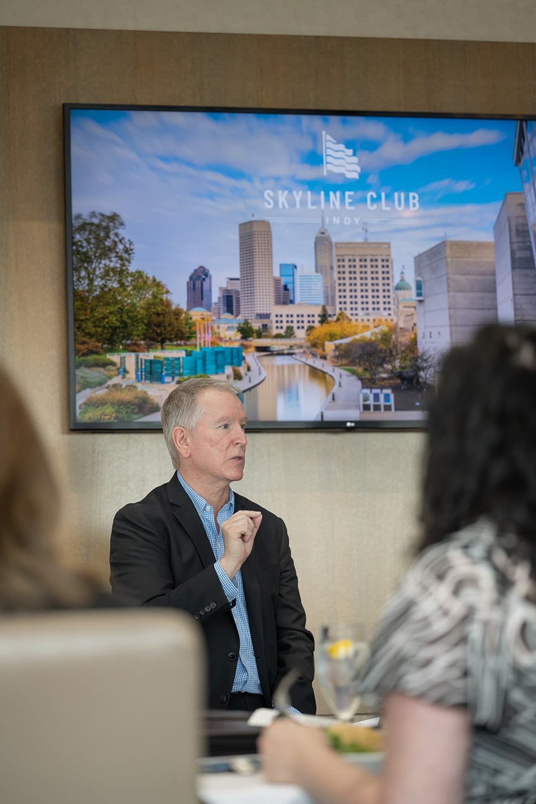 Man speaking at a meeting