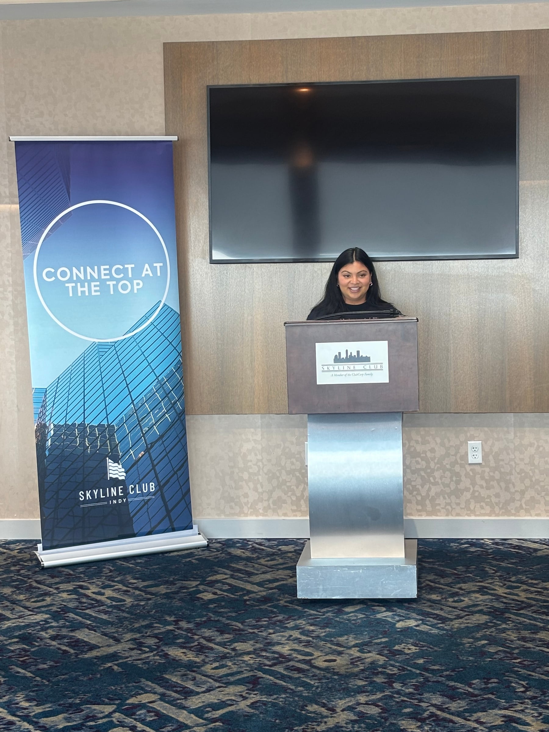 Woman standing at a podium
