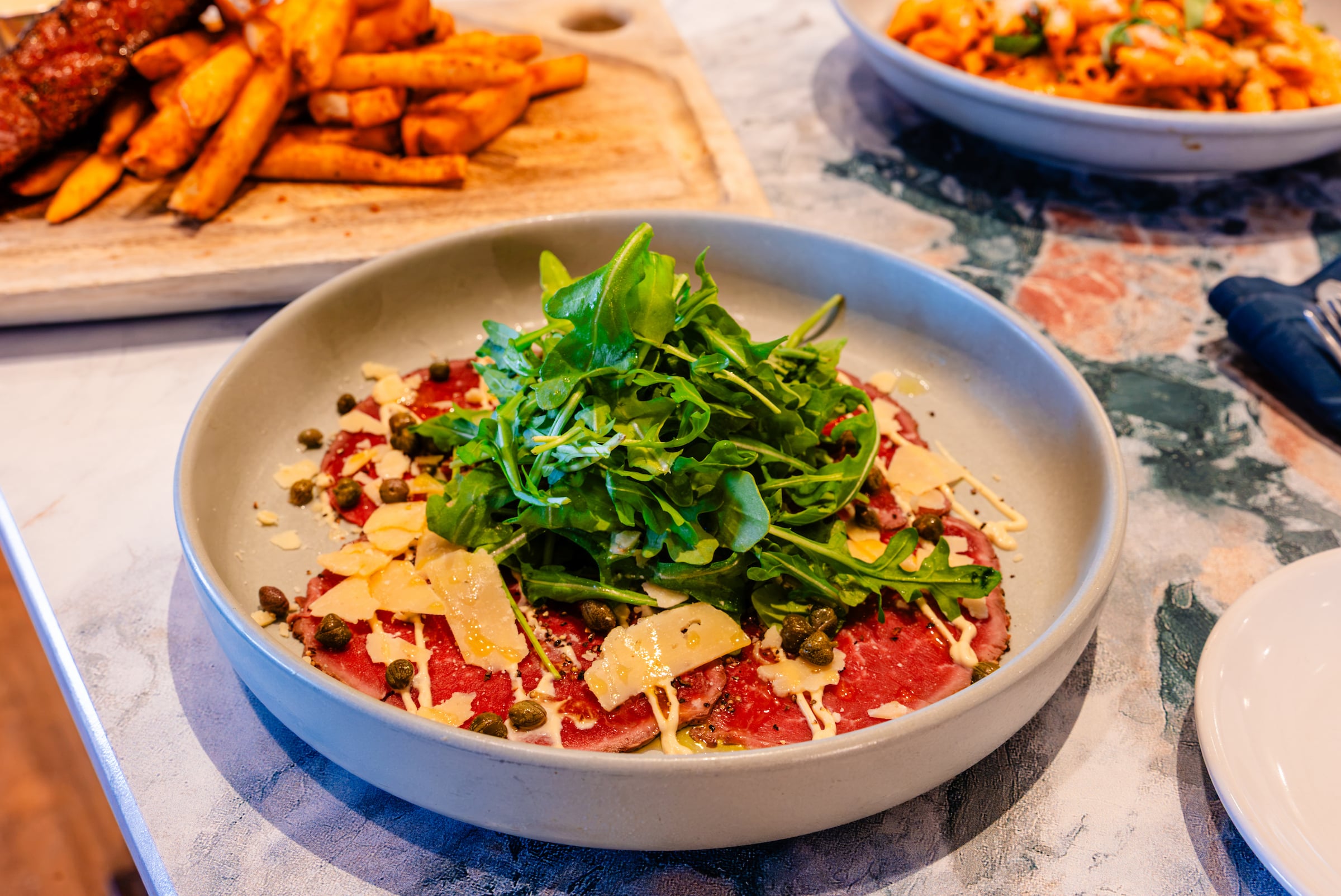 Crusted tuna with arugula and parmesean