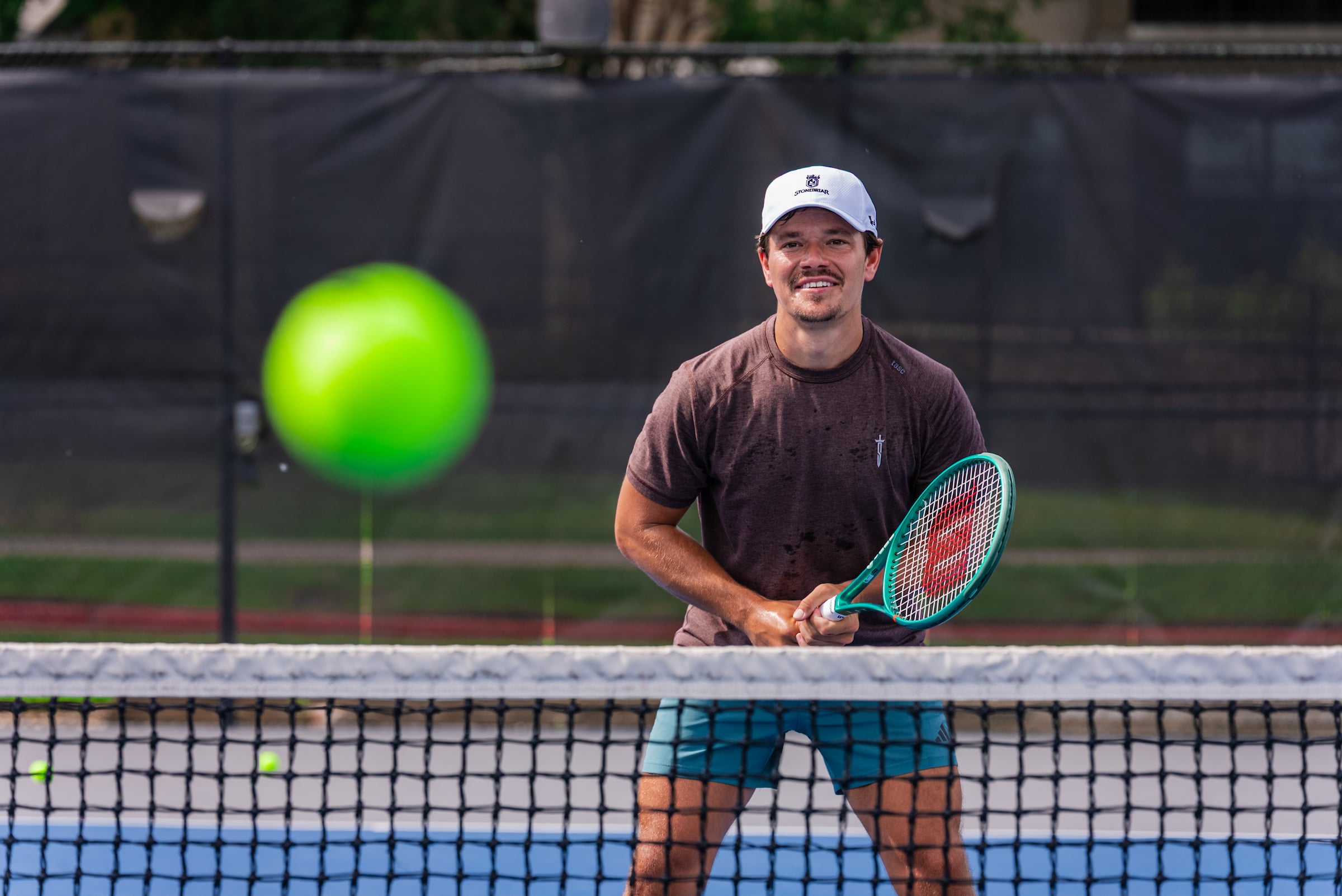 Man getting ready to hit a tennis ball