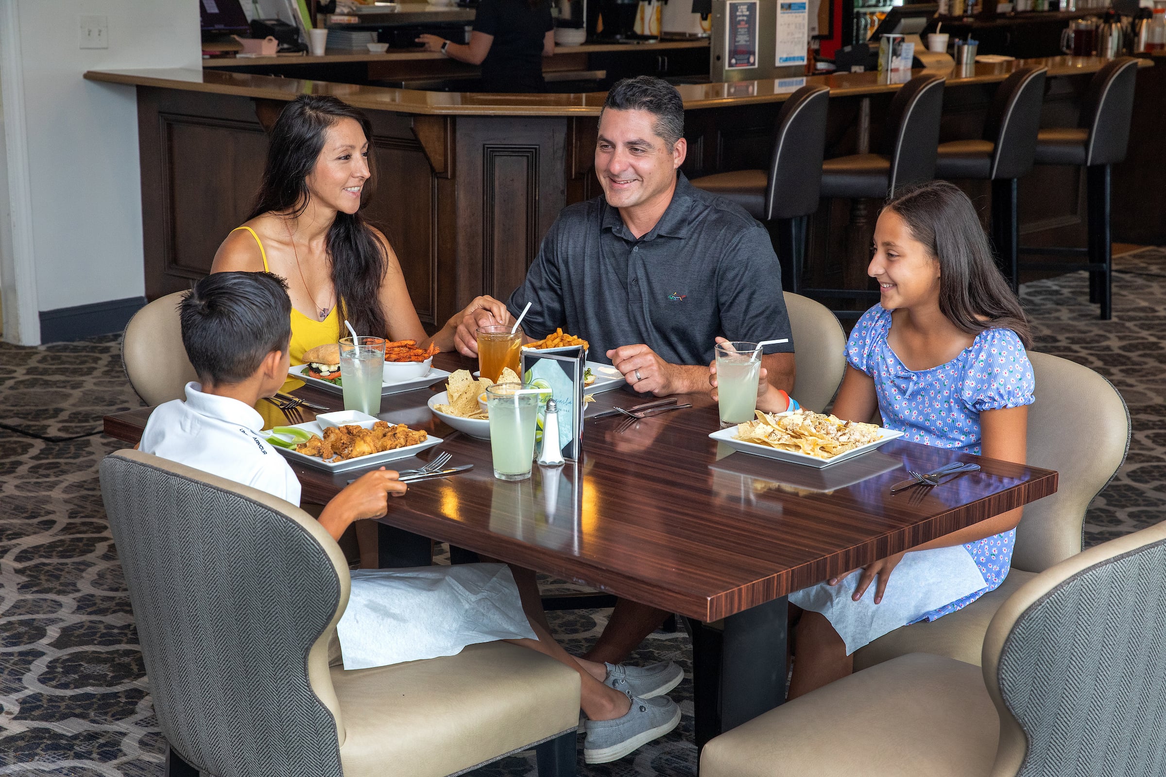 Family of four dining