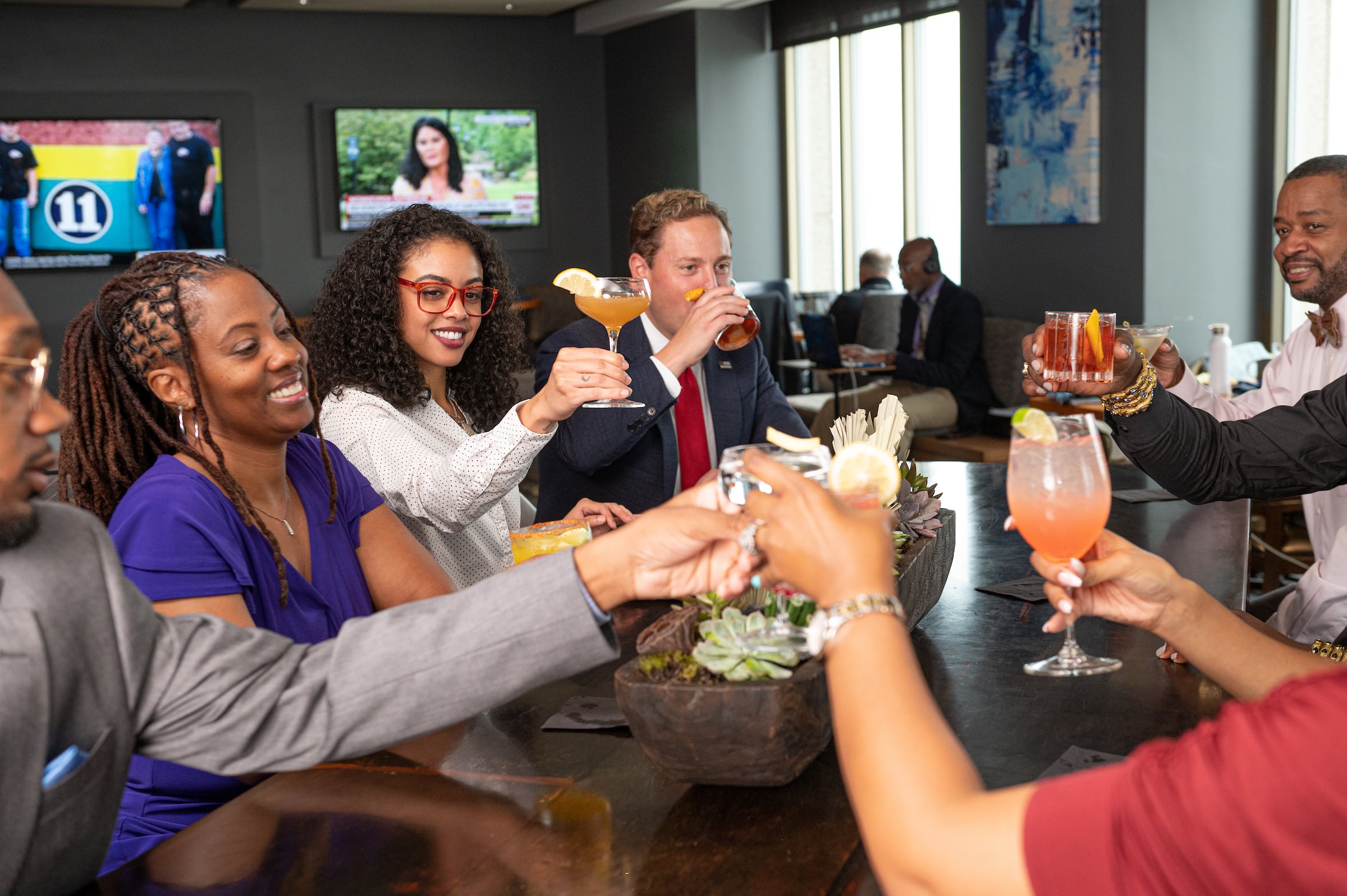 Mixed group toasting drinks