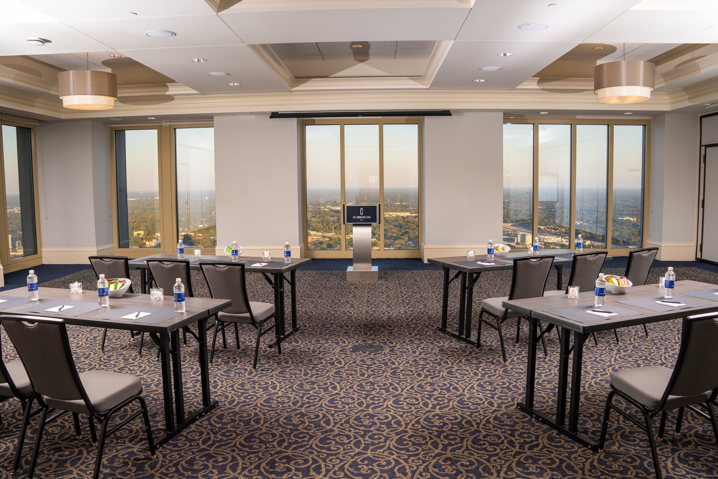 room with tables set up for a meeting