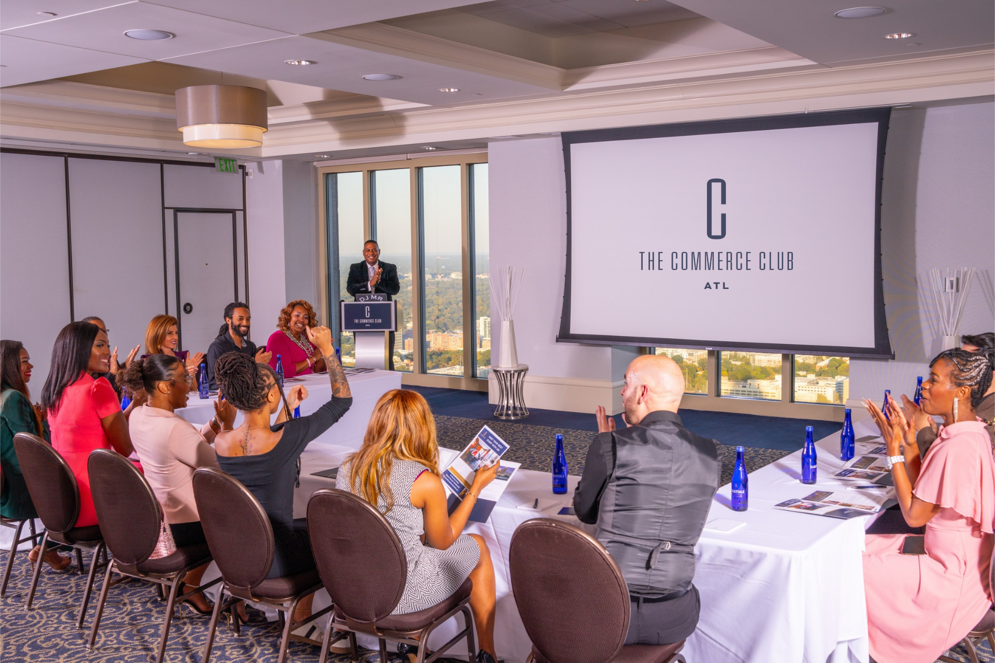 Men & Women in a boardroom meeting at The Commerce Club Atlanta
