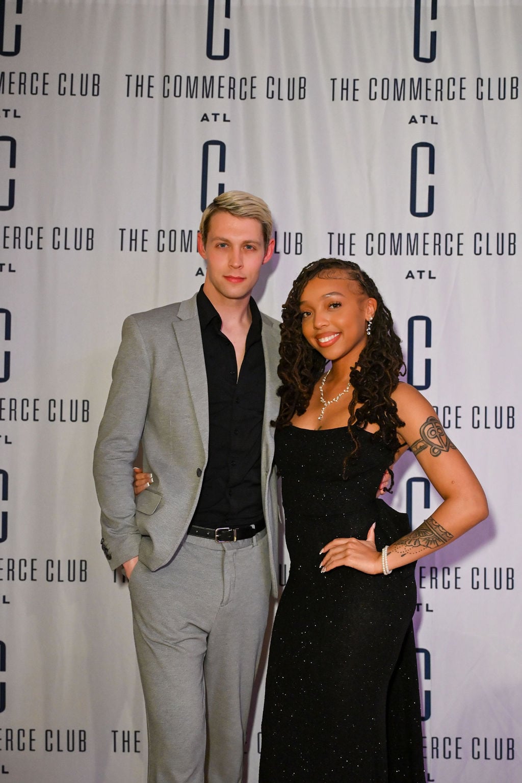 Man & woman at a private event celebrating women