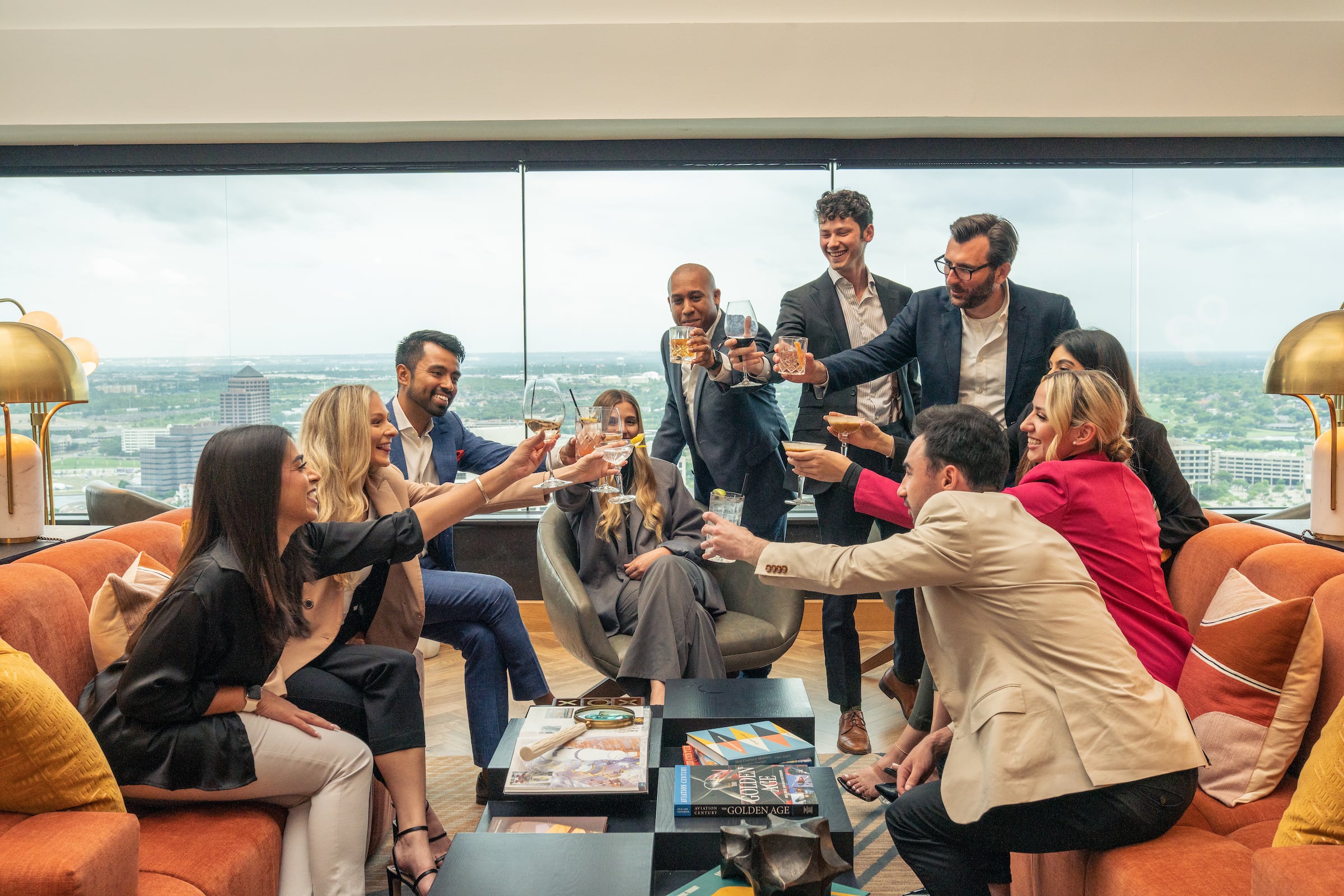 Large group of people cheersing at a private event