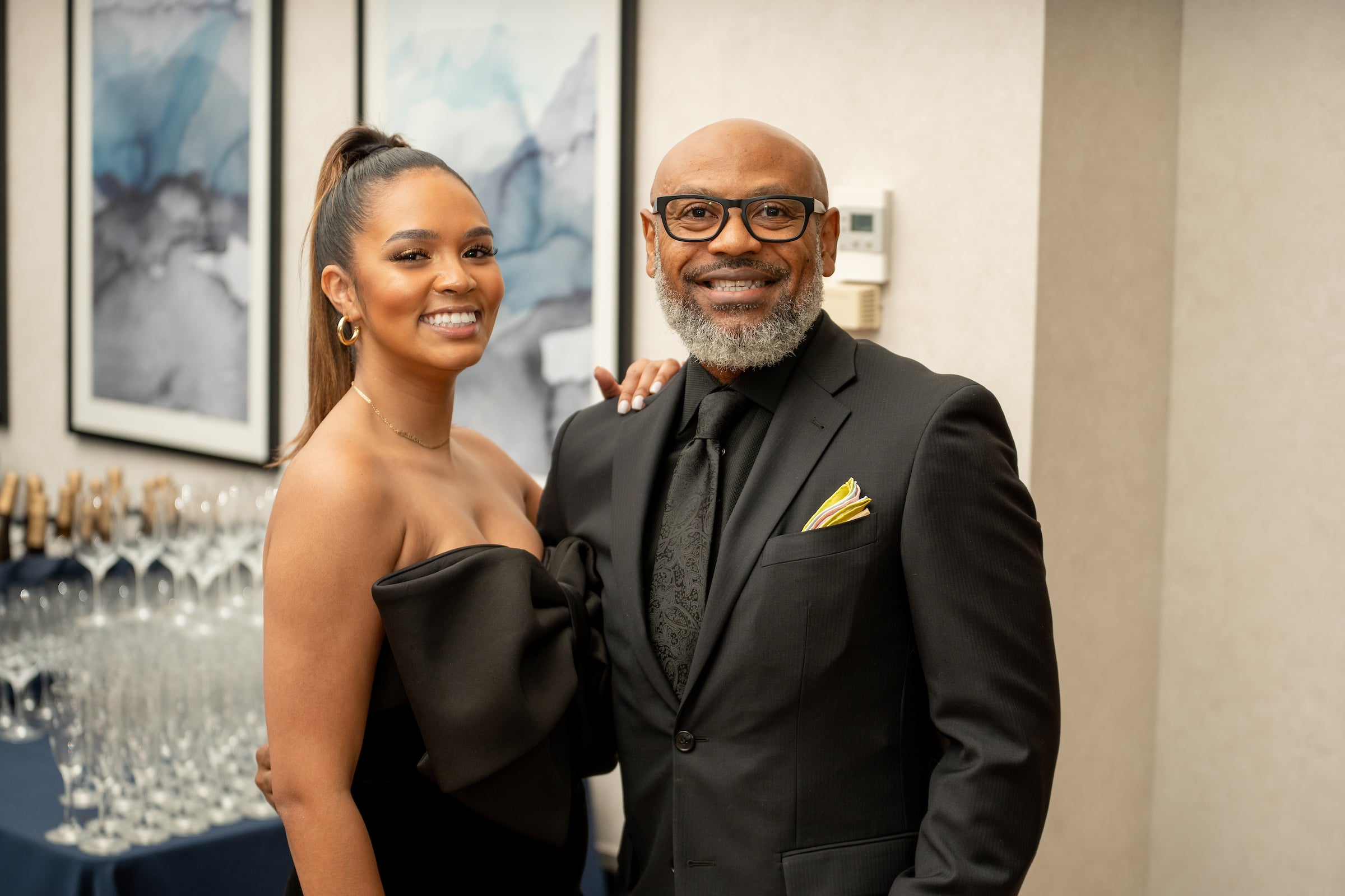 Man & woman posing for picture at a private event
