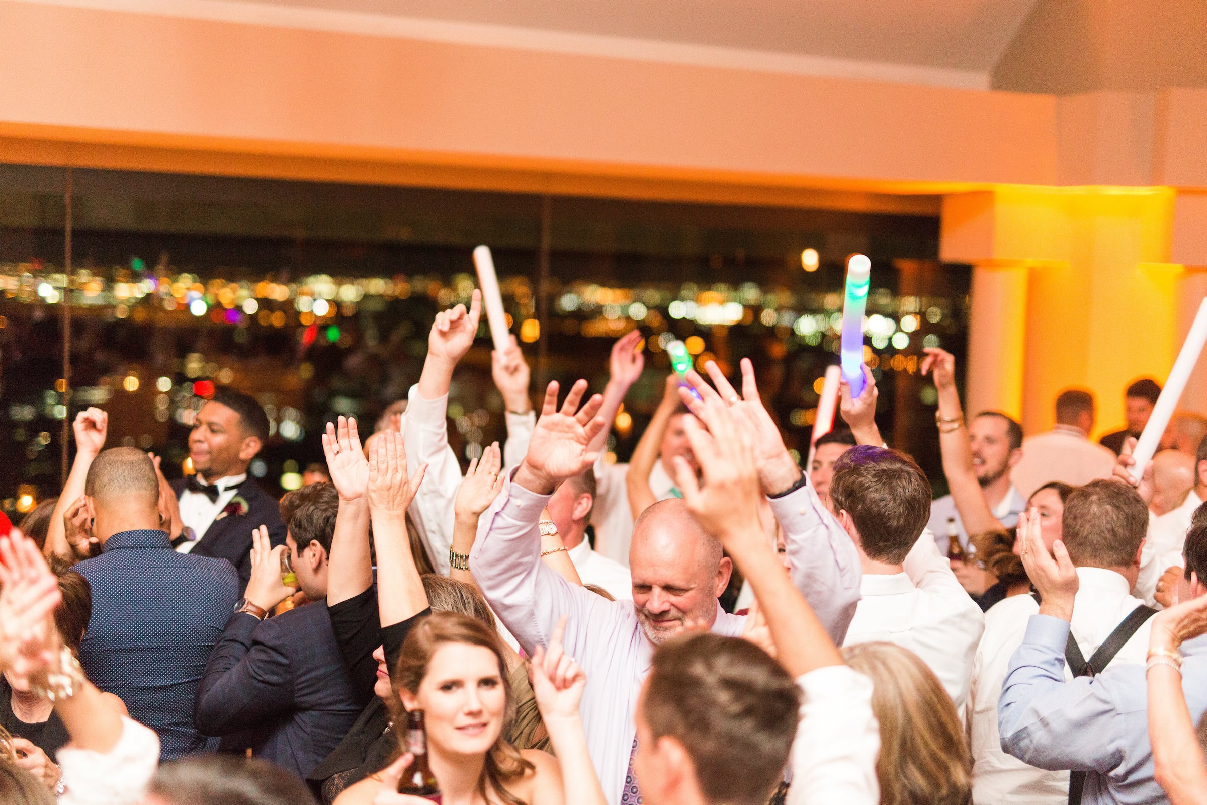 Large group dancing at wedding reception