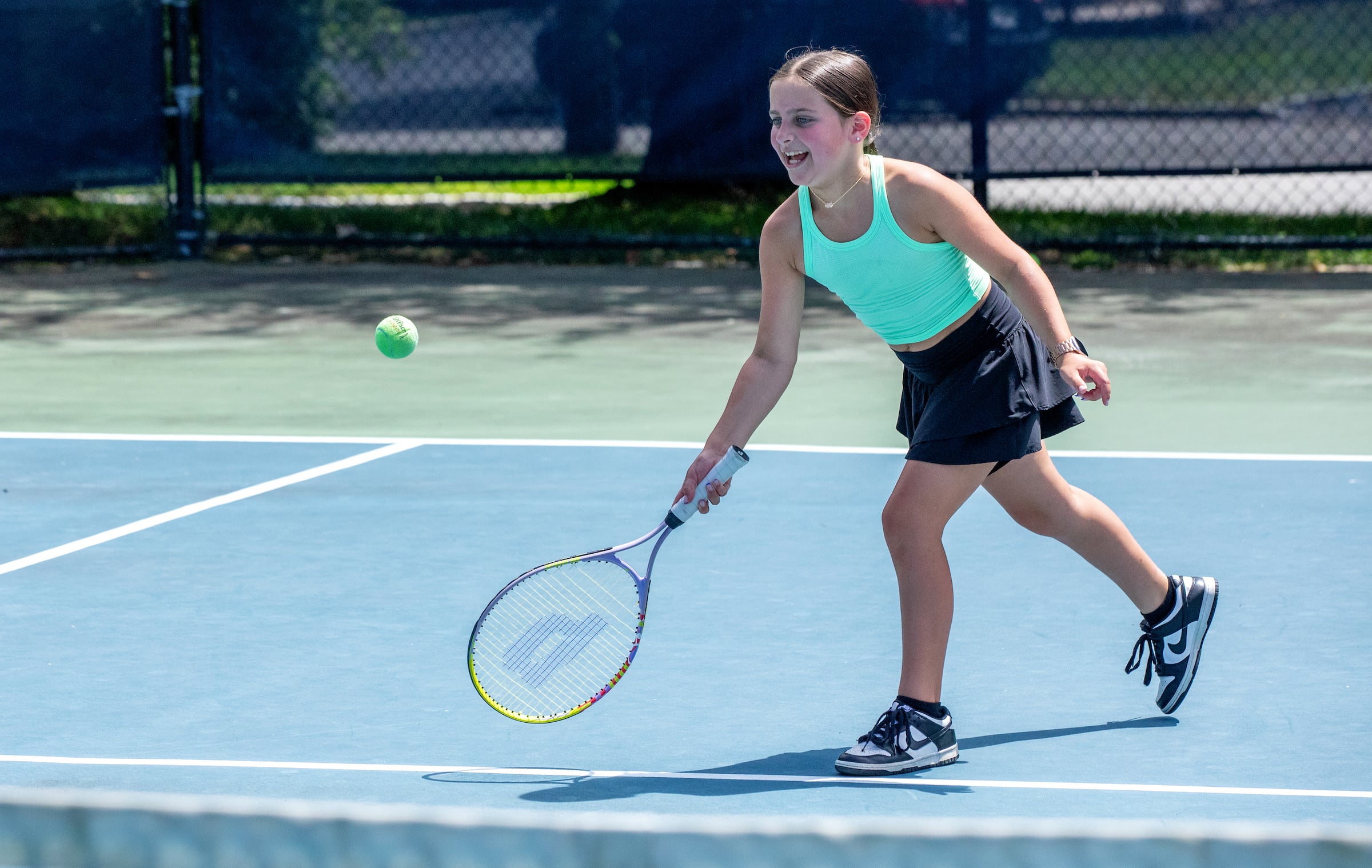 young girl playing tennis