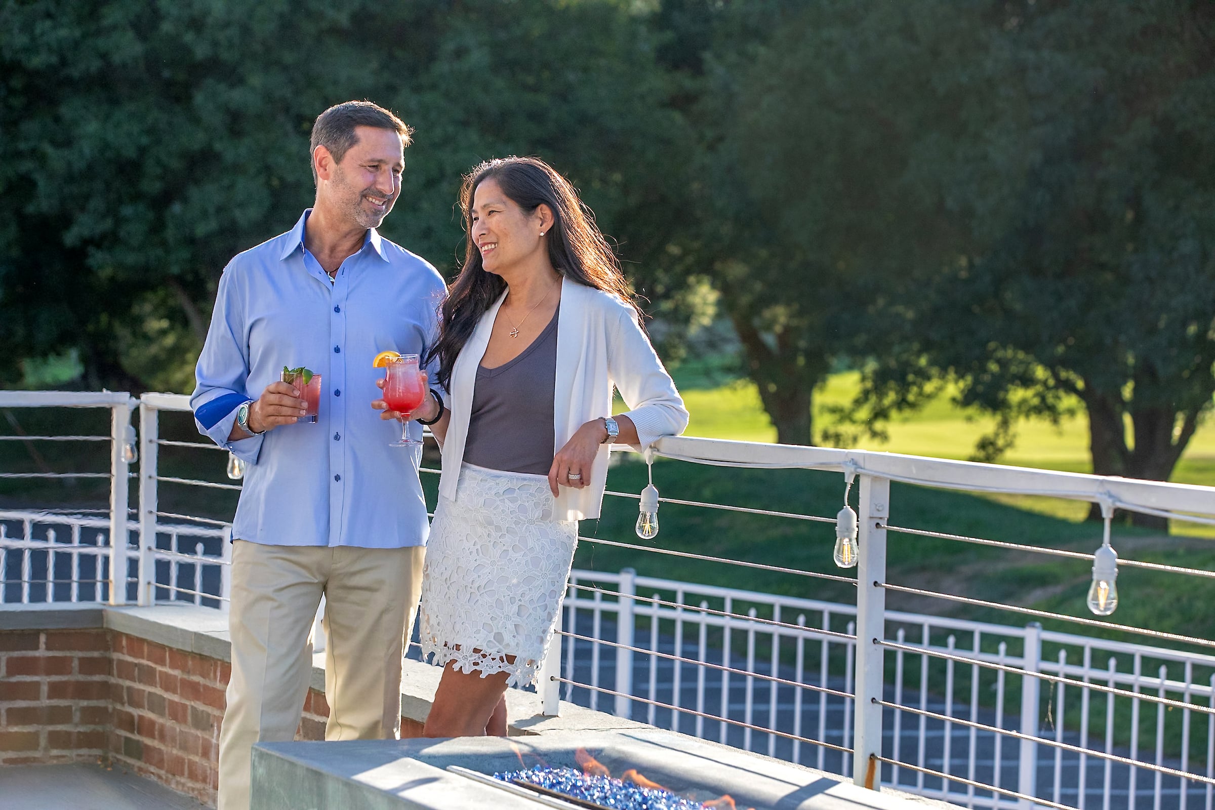 Couple enjoying drinks on a patio