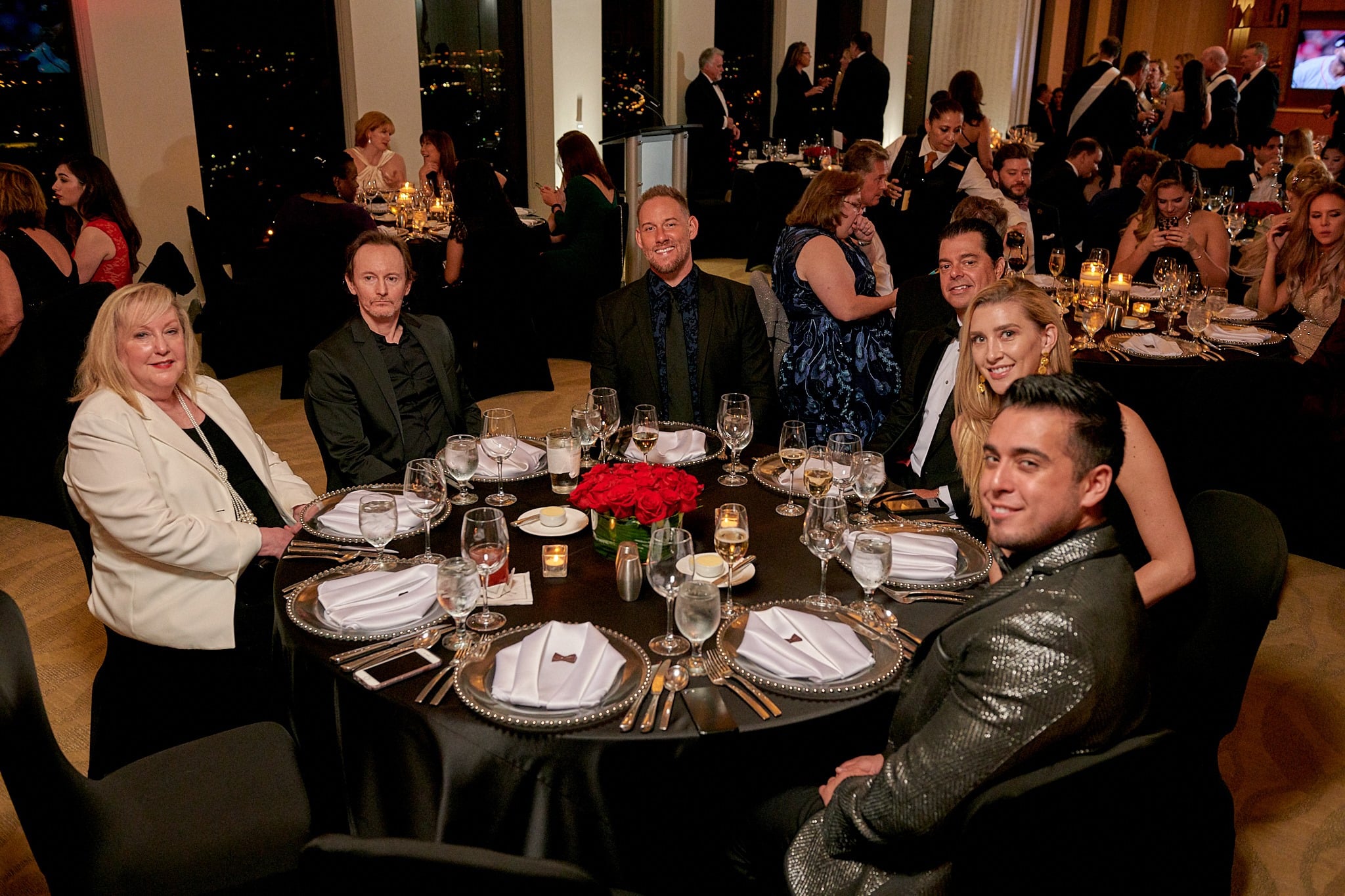 Multiple people & tables at a private event