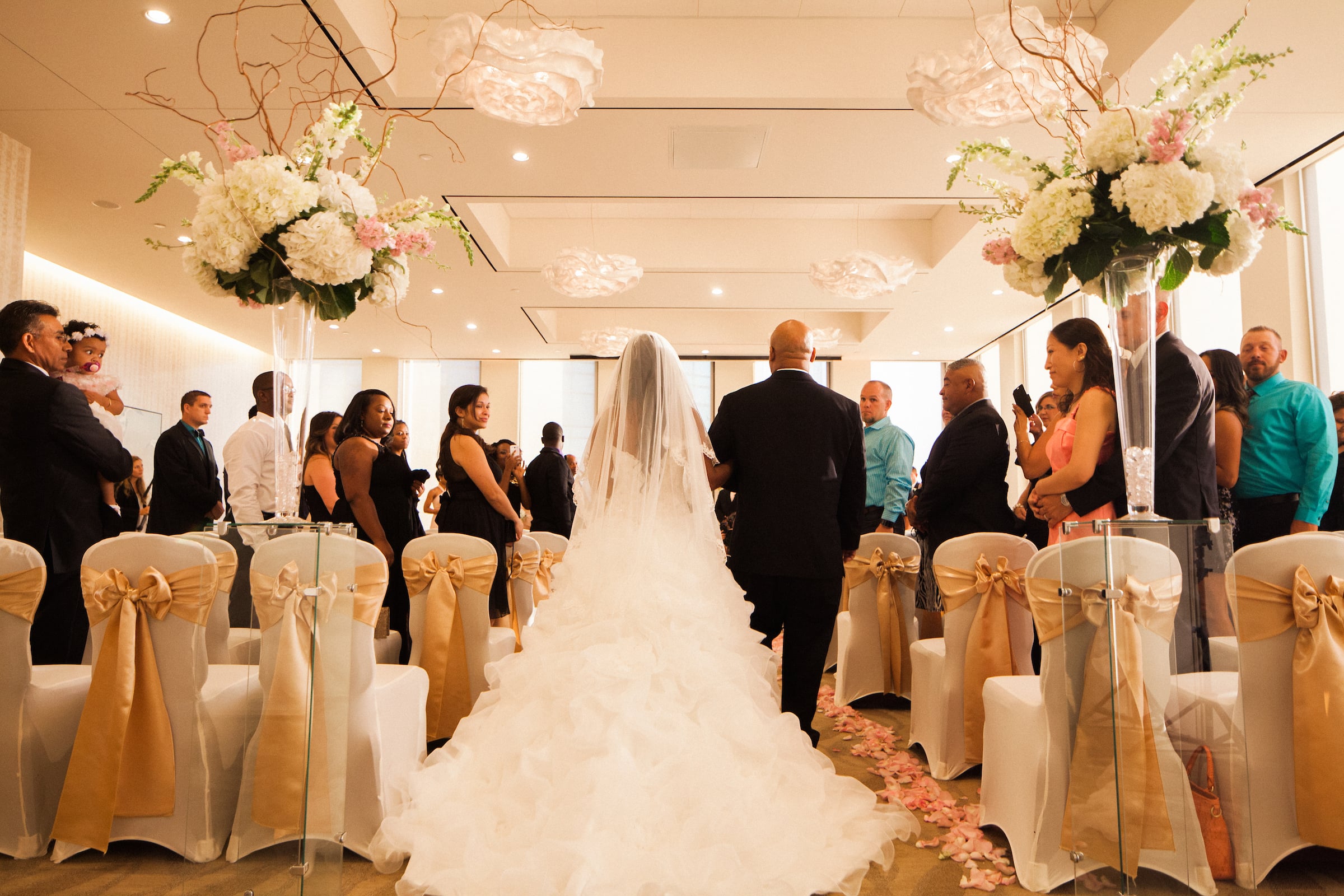 Rear view of Bride & Father walking down the isle