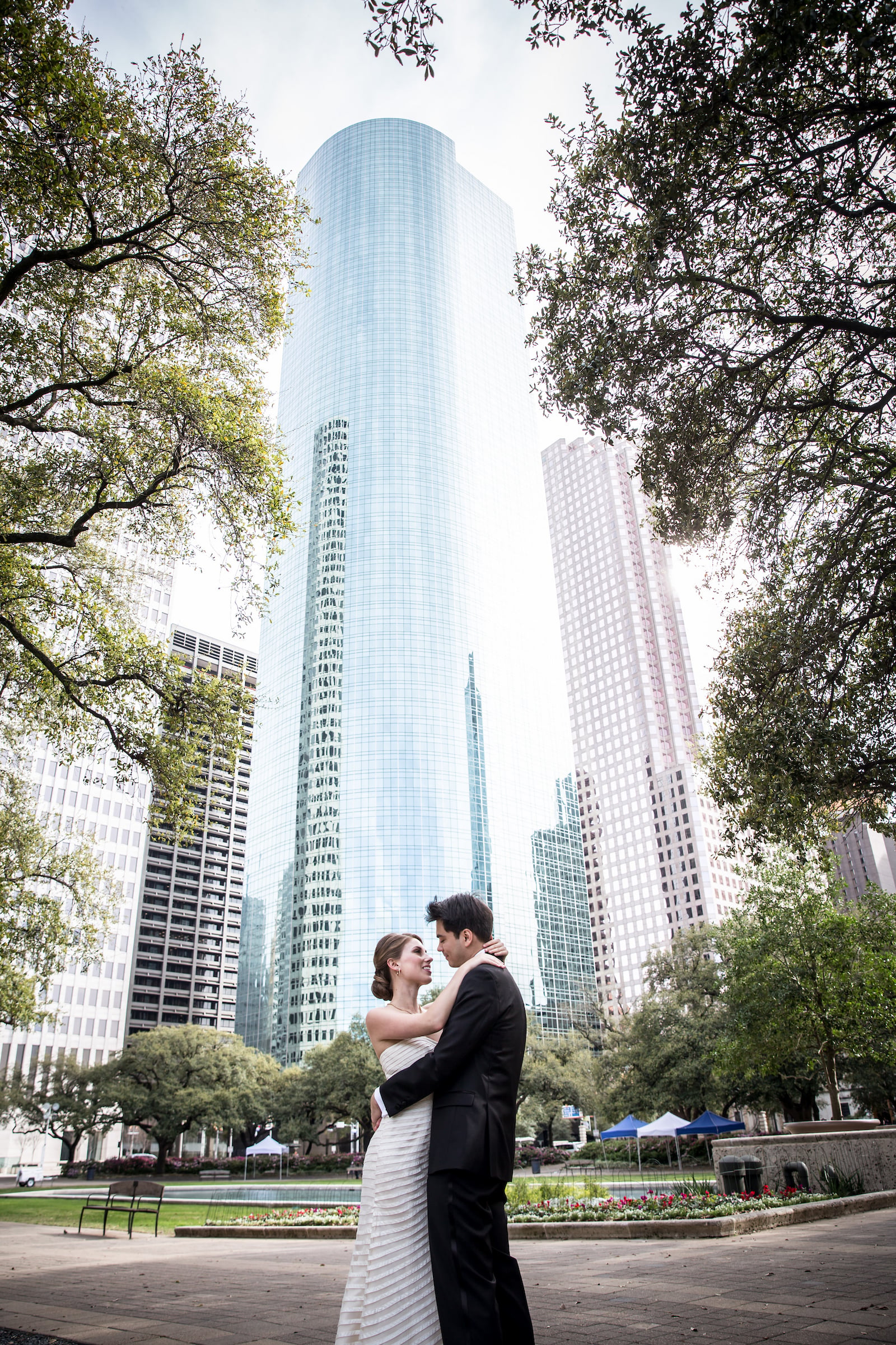 Bride & Groom standing outside in front of the One Shell Plaza in Houston, TX