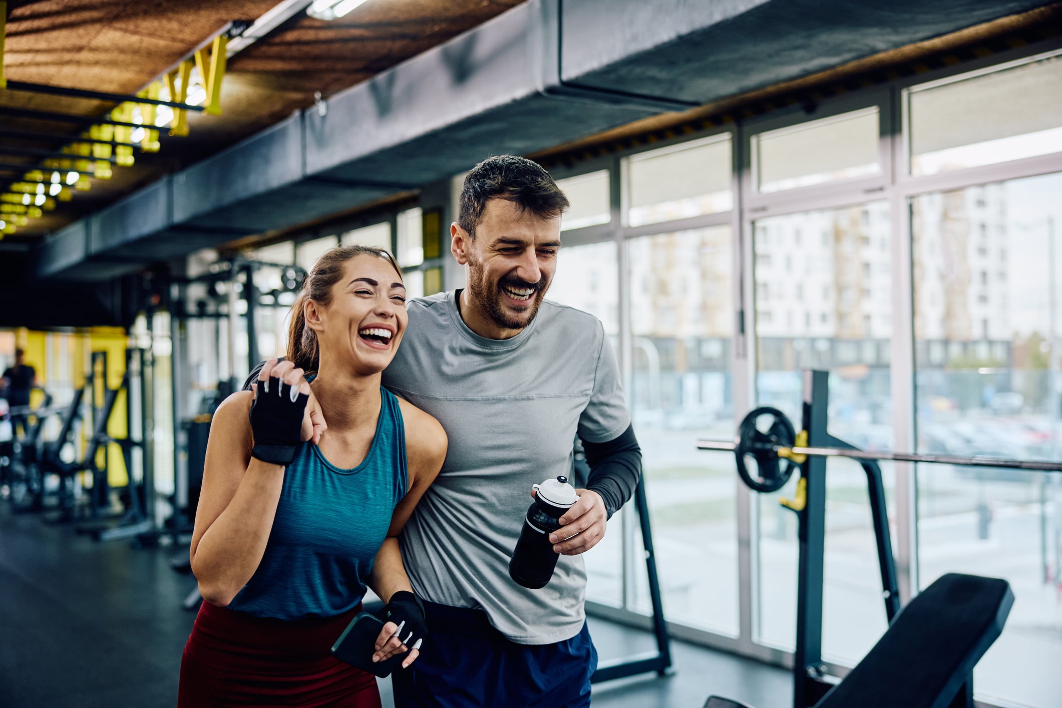Man & Woman walking during a workout