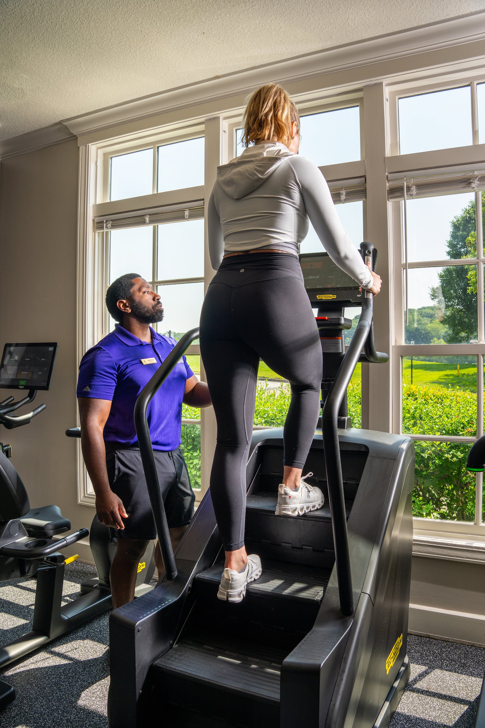 Woman working out with trainer