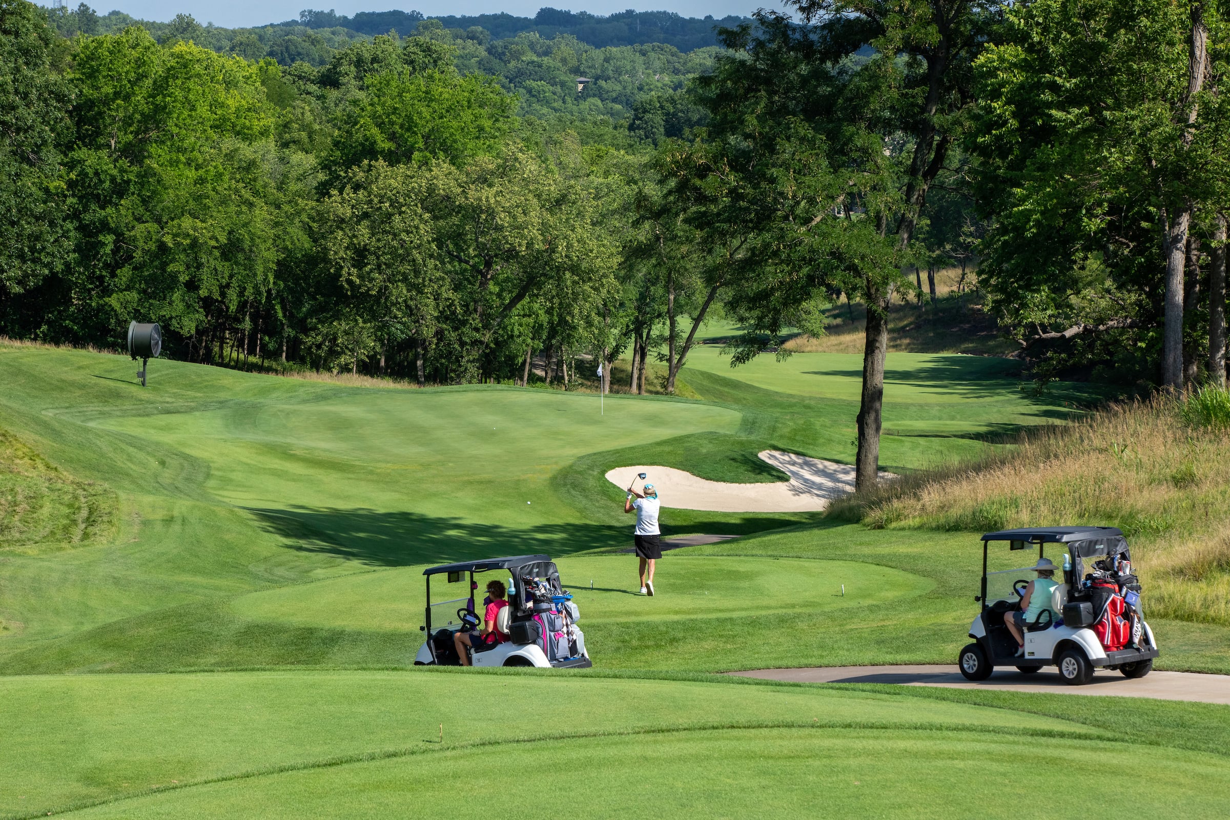 Golfers on carts on course