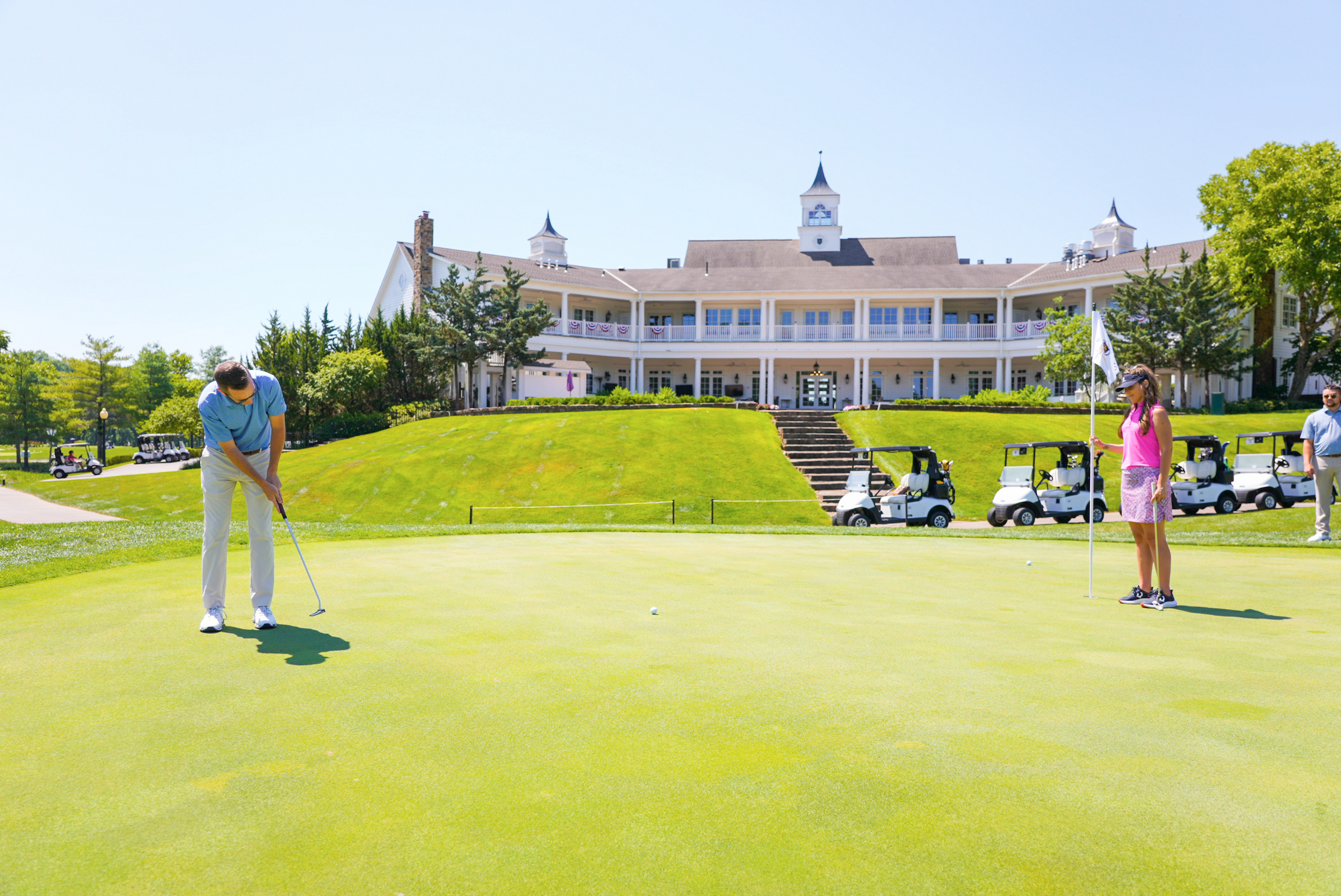 Golfers in front of clubhouse