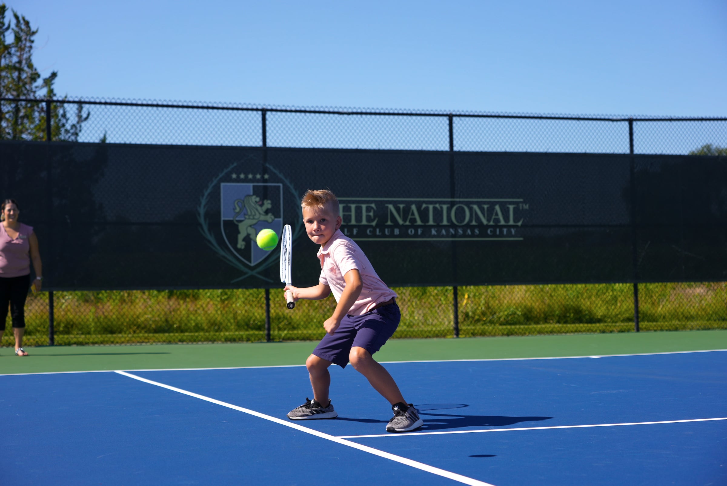 Child playing tennis