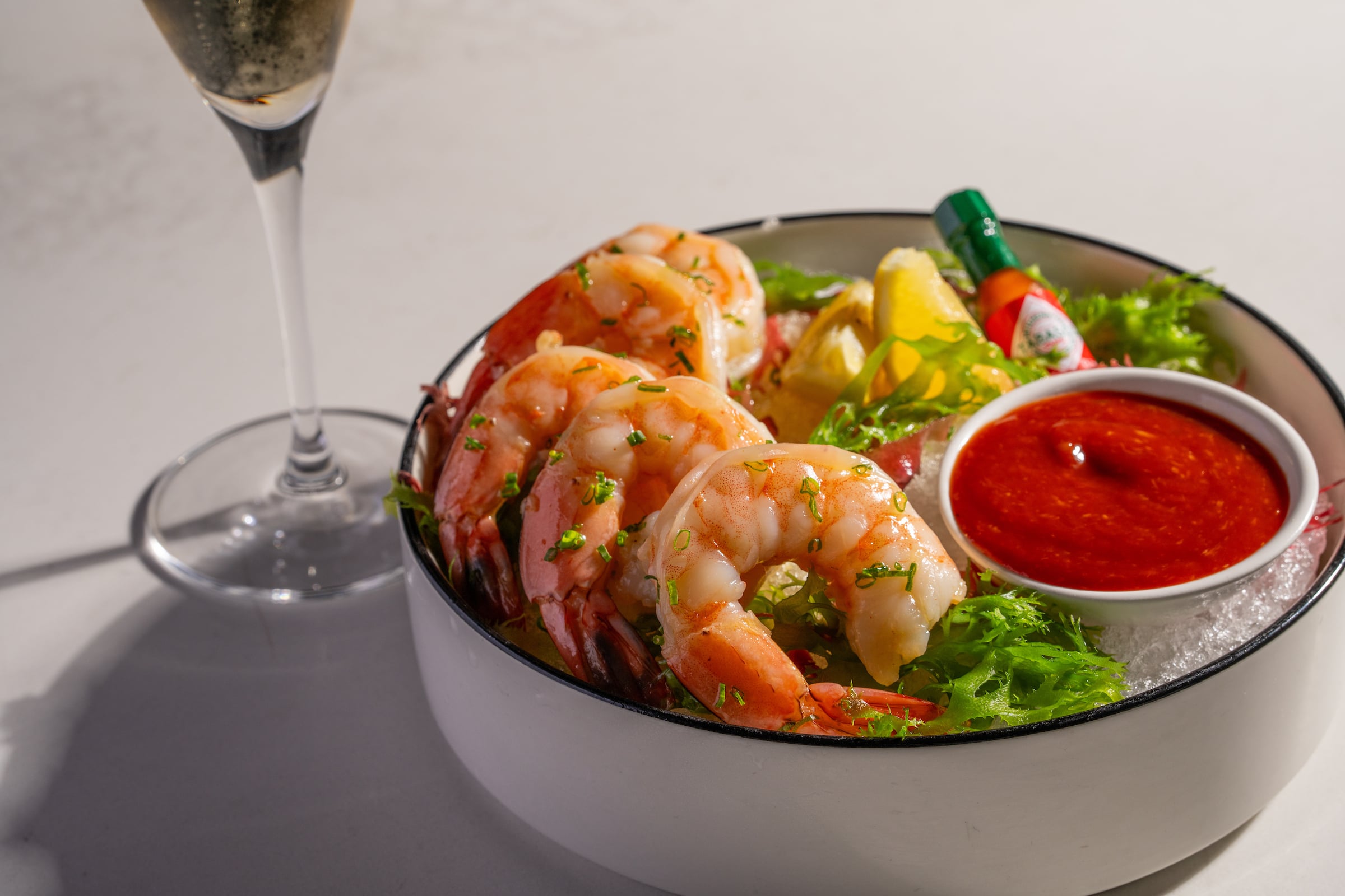 Bowl of shrimp with cocktail sauce
