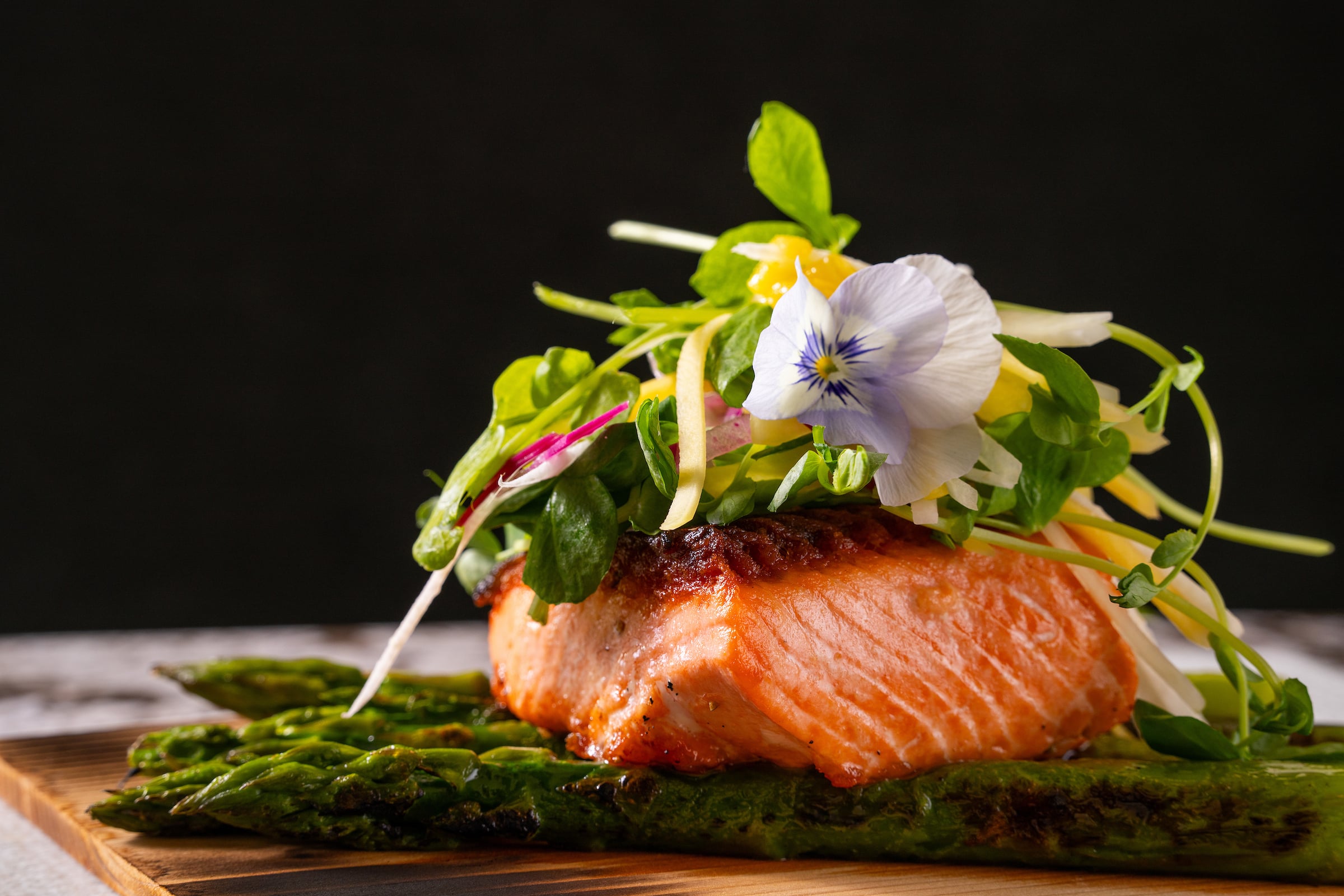 Salmon fillet on top of asparagus