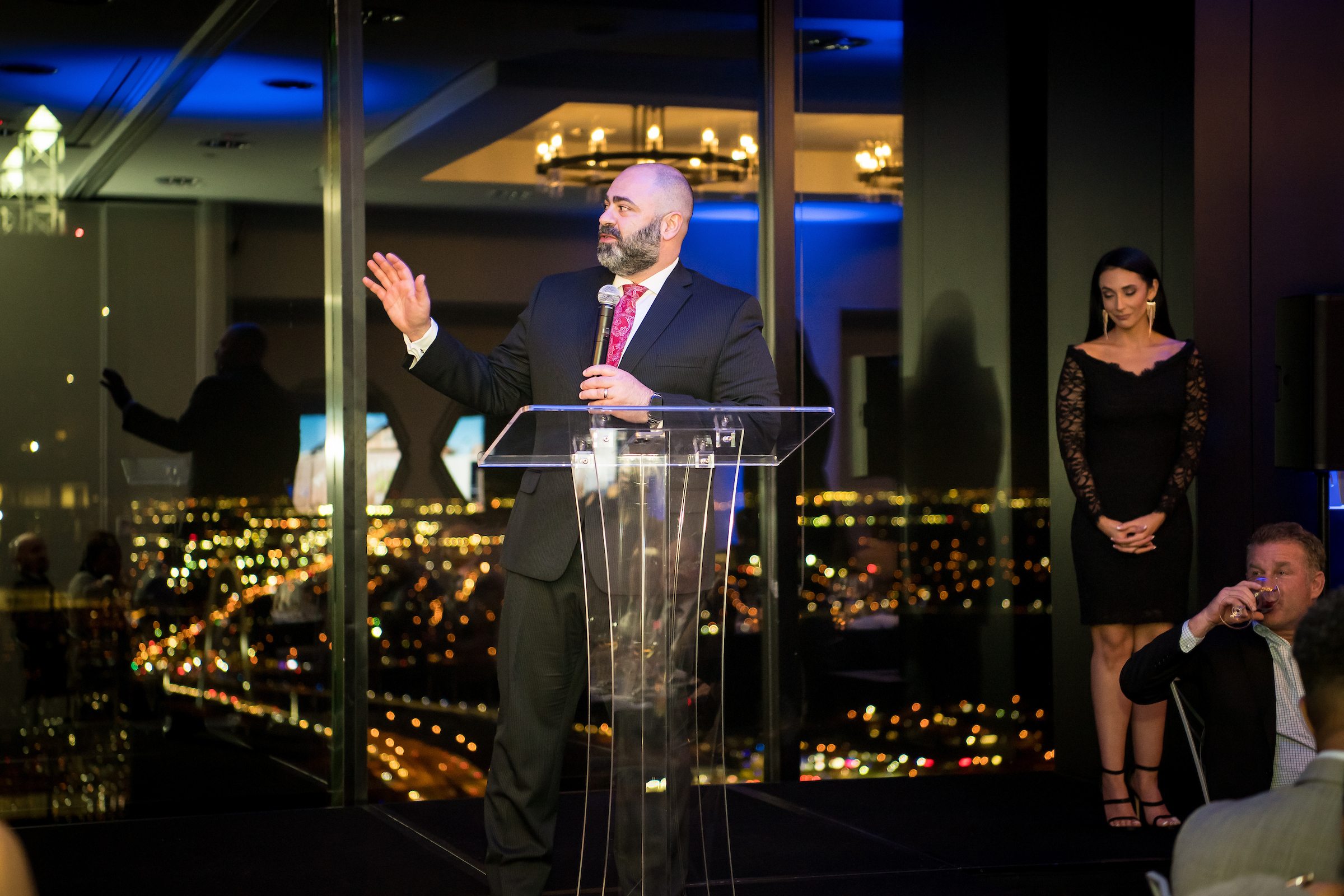 Man speaking at an evening Tower Club Dallas meeting