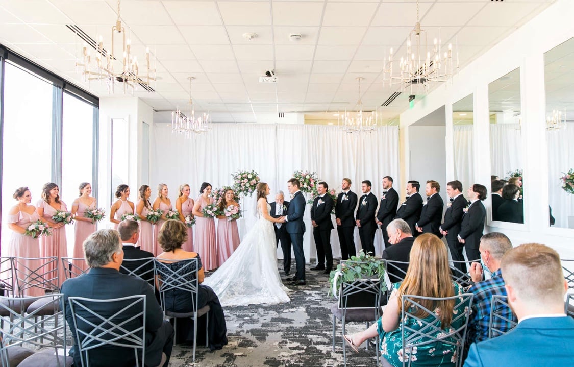 Wedding Ceremony showing large Bridal Party