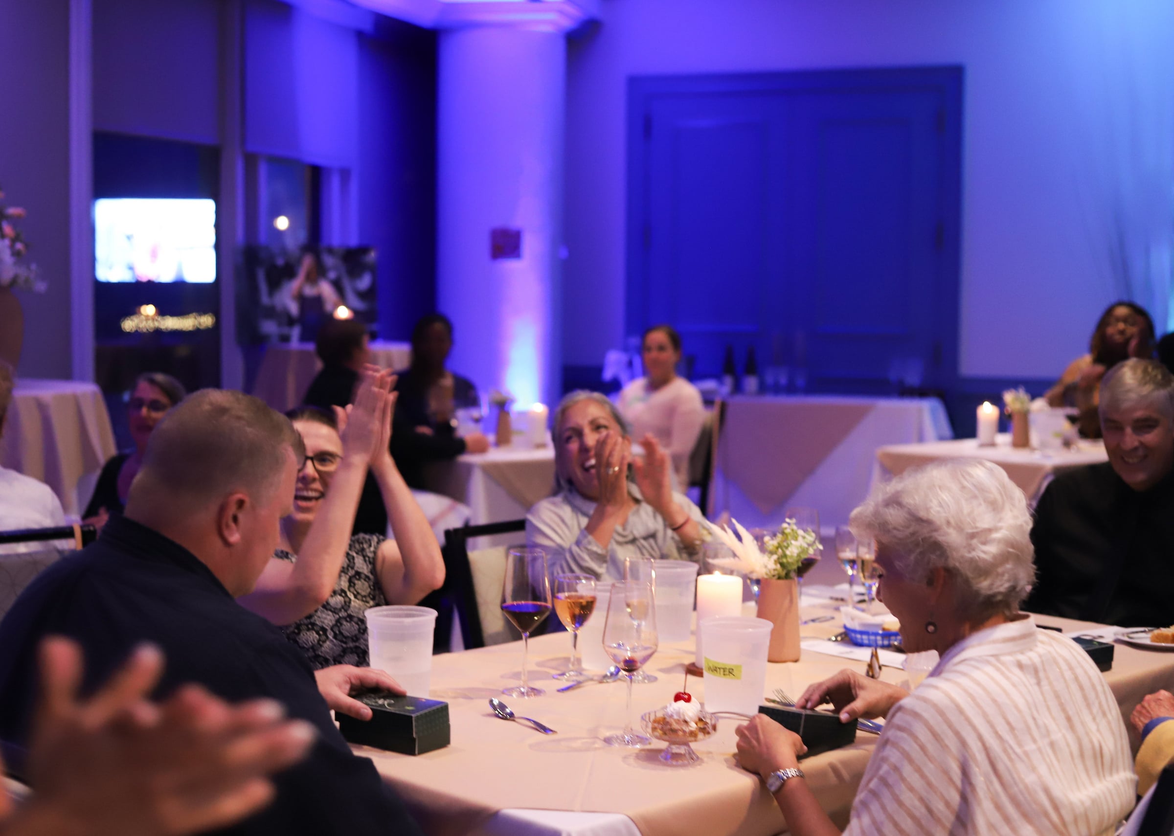 Private event dinner with people clapping