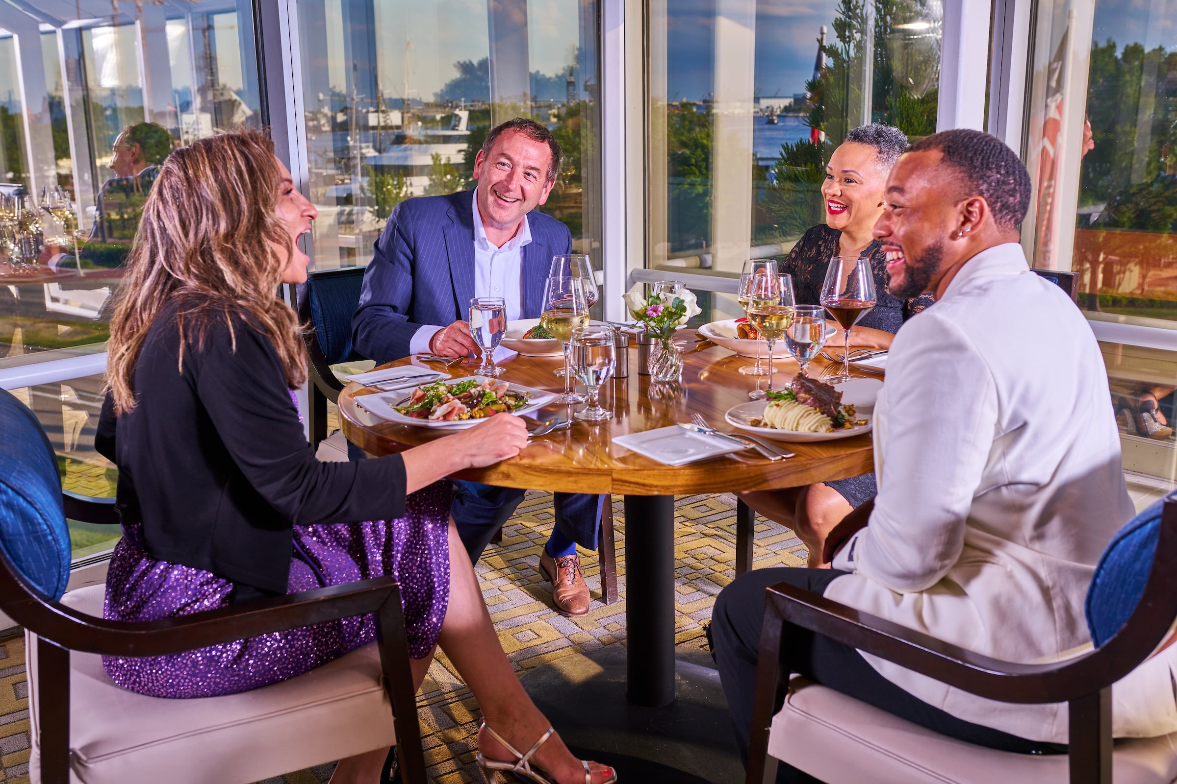 Two couples dining