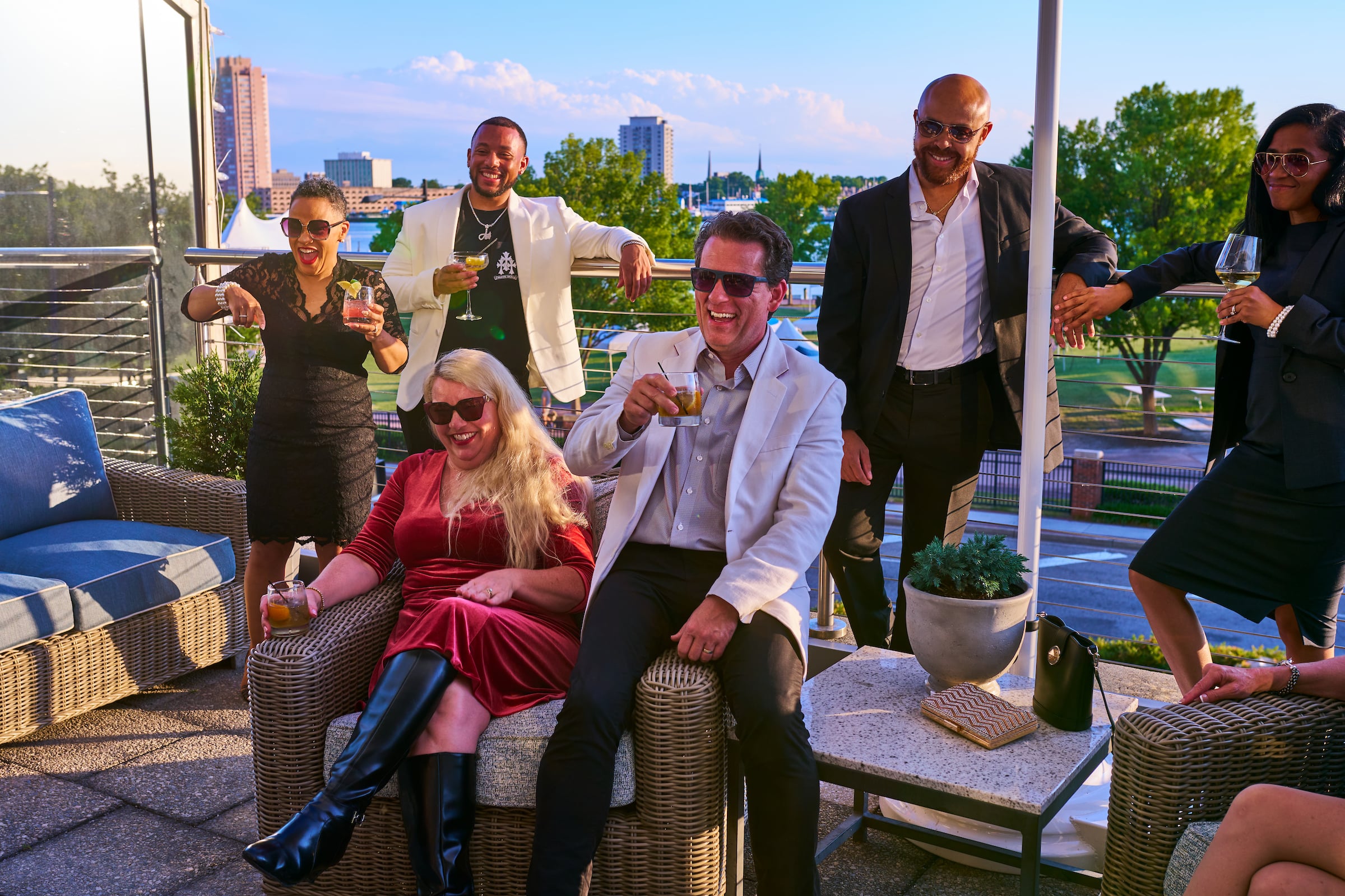Mixed group having drinks on Town Point Club patio