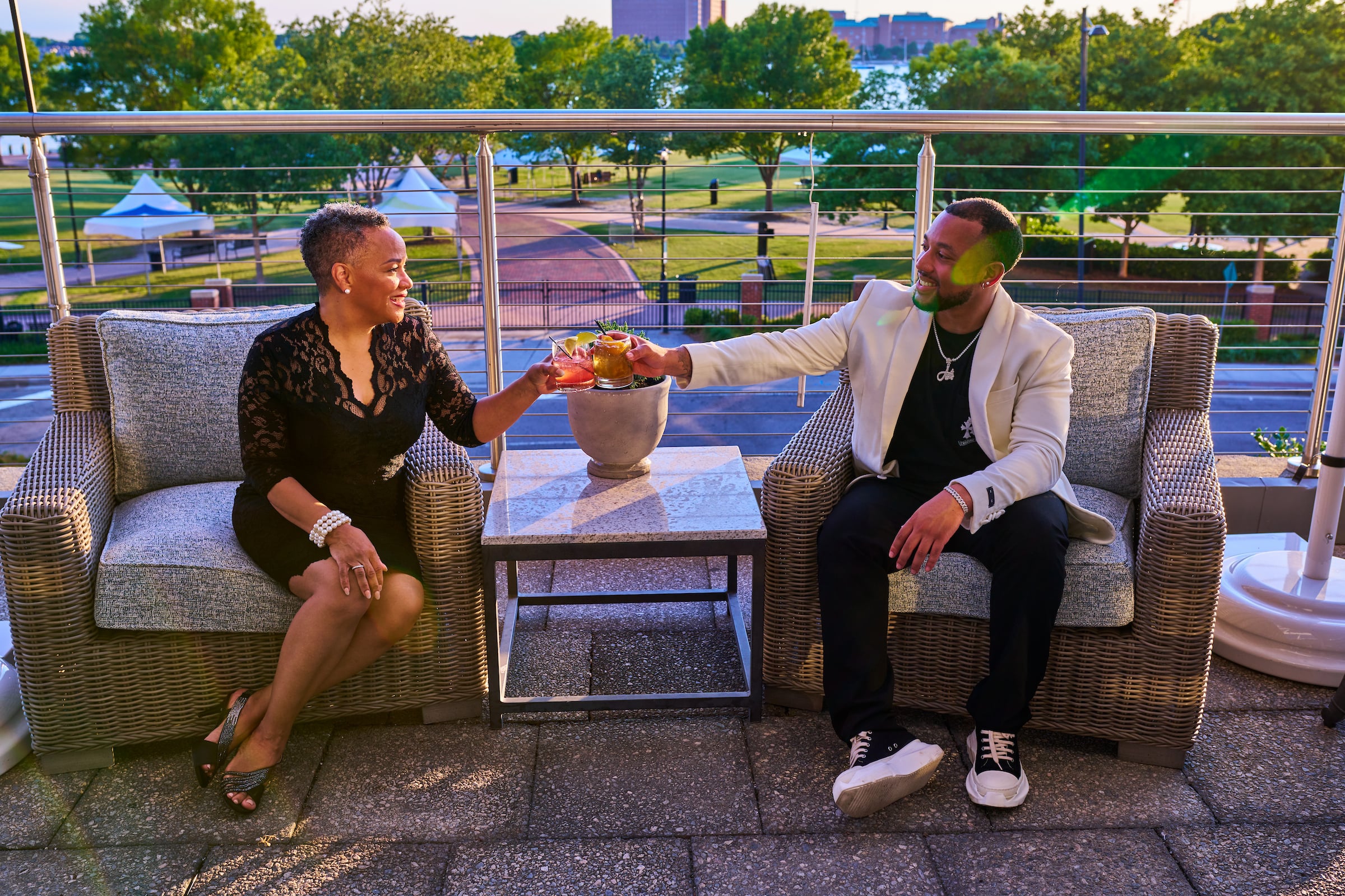Man & Woman having drinks on patio