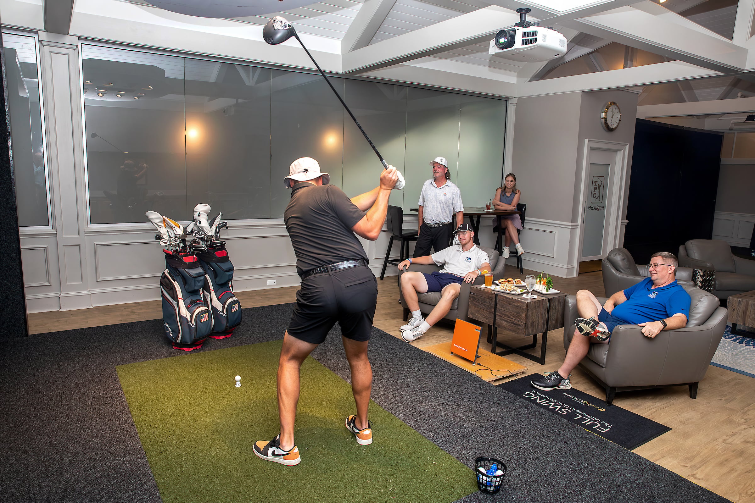 Man using a golf simulator