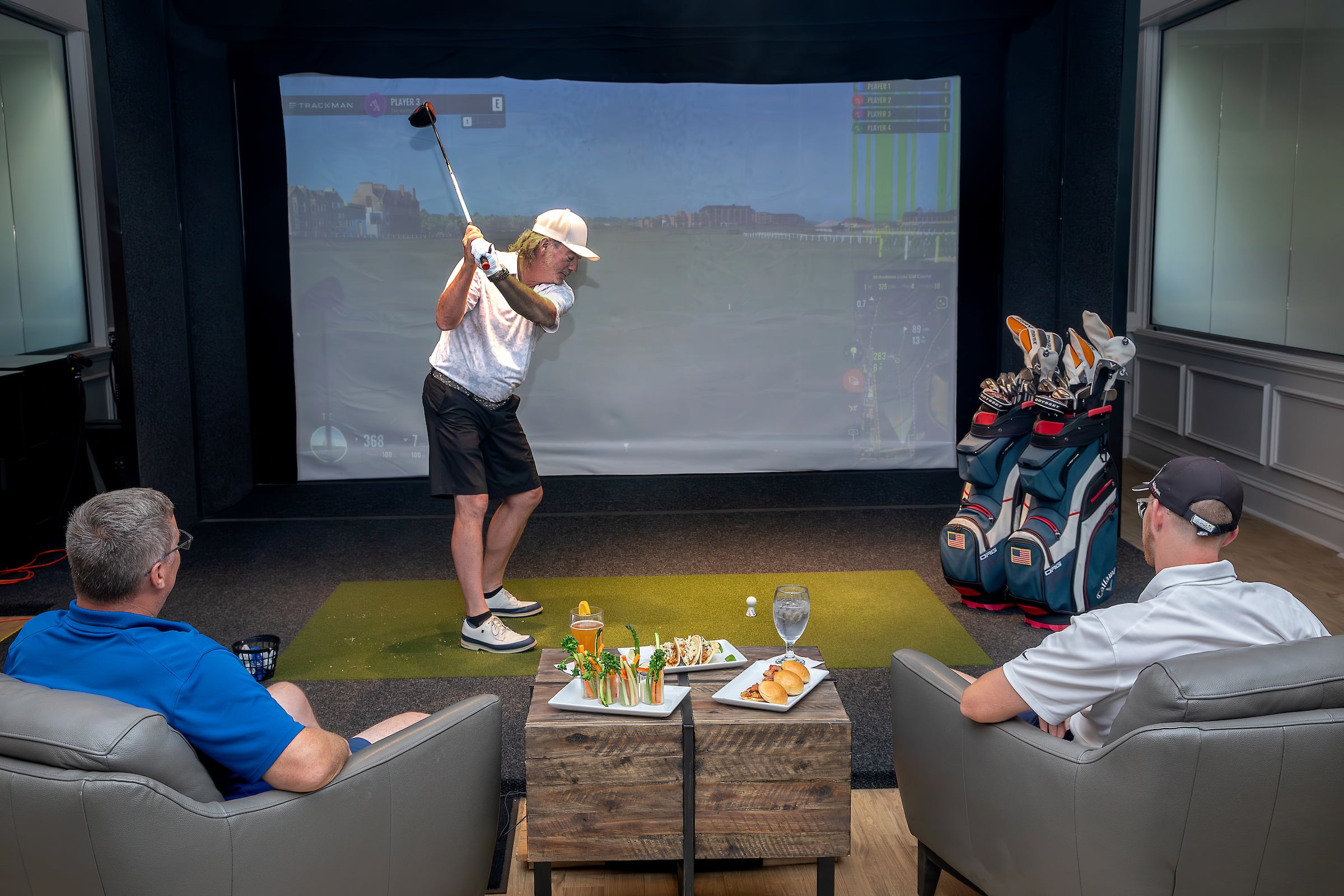 man using a golf simulator