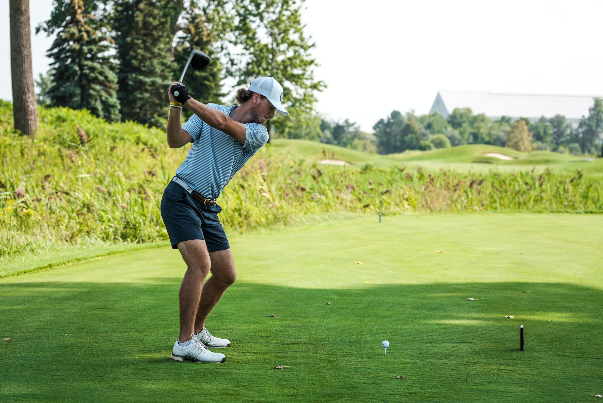 Man swinging a golf club