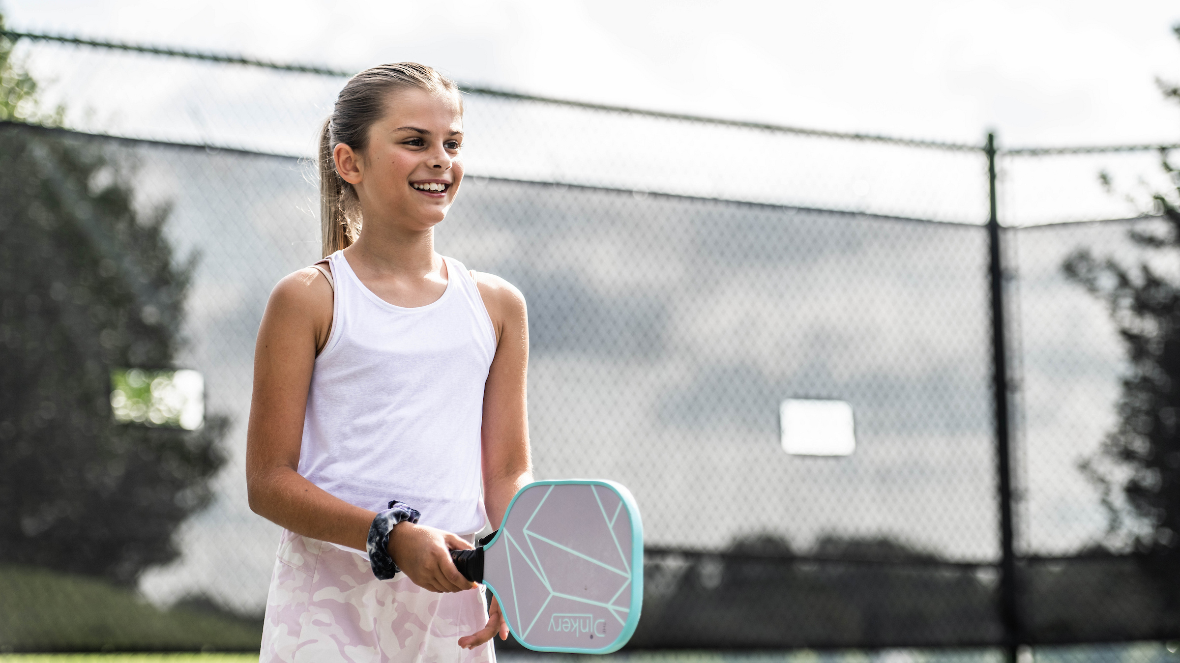 Young girl playing tennis