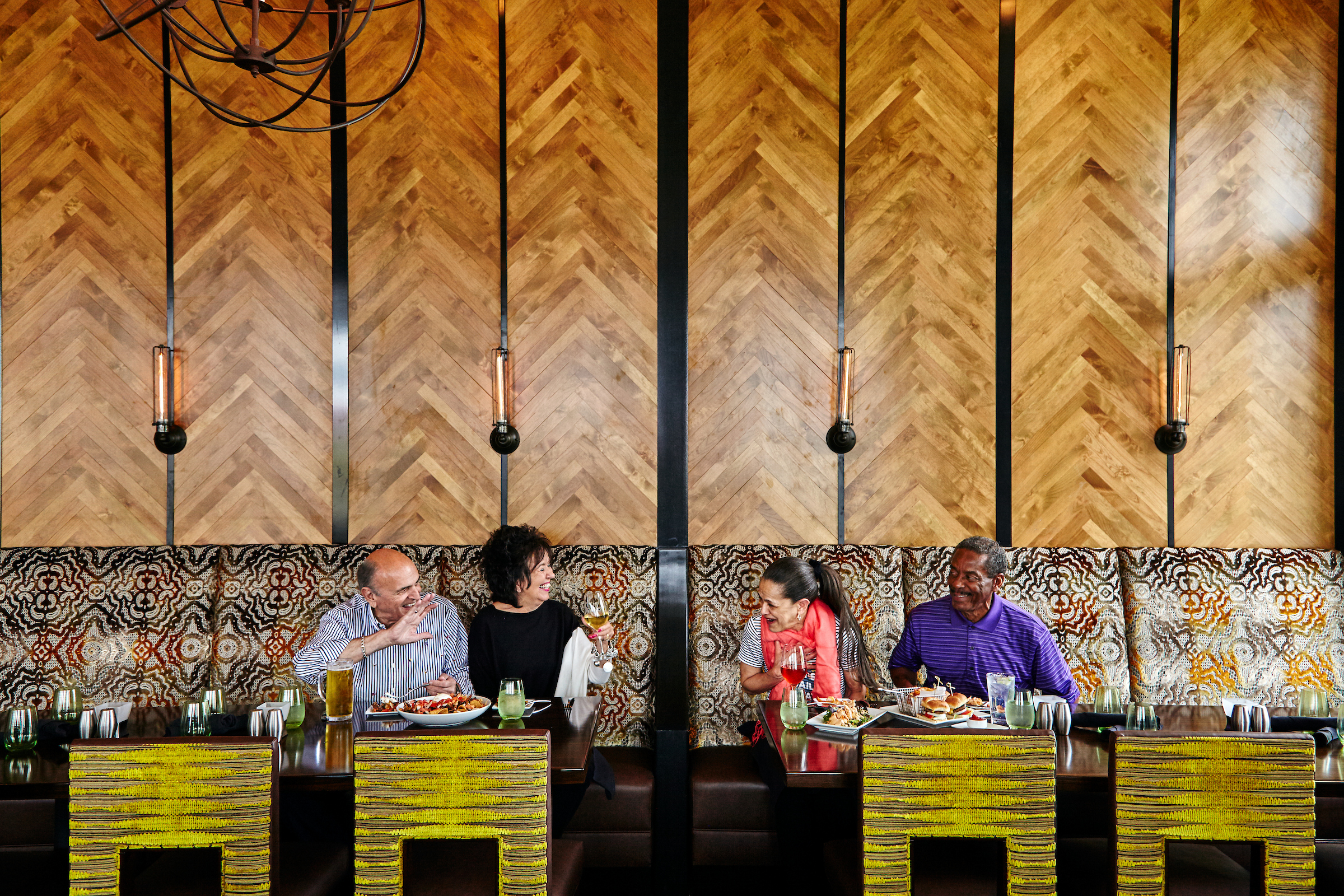 2 couples enjoying a meal together