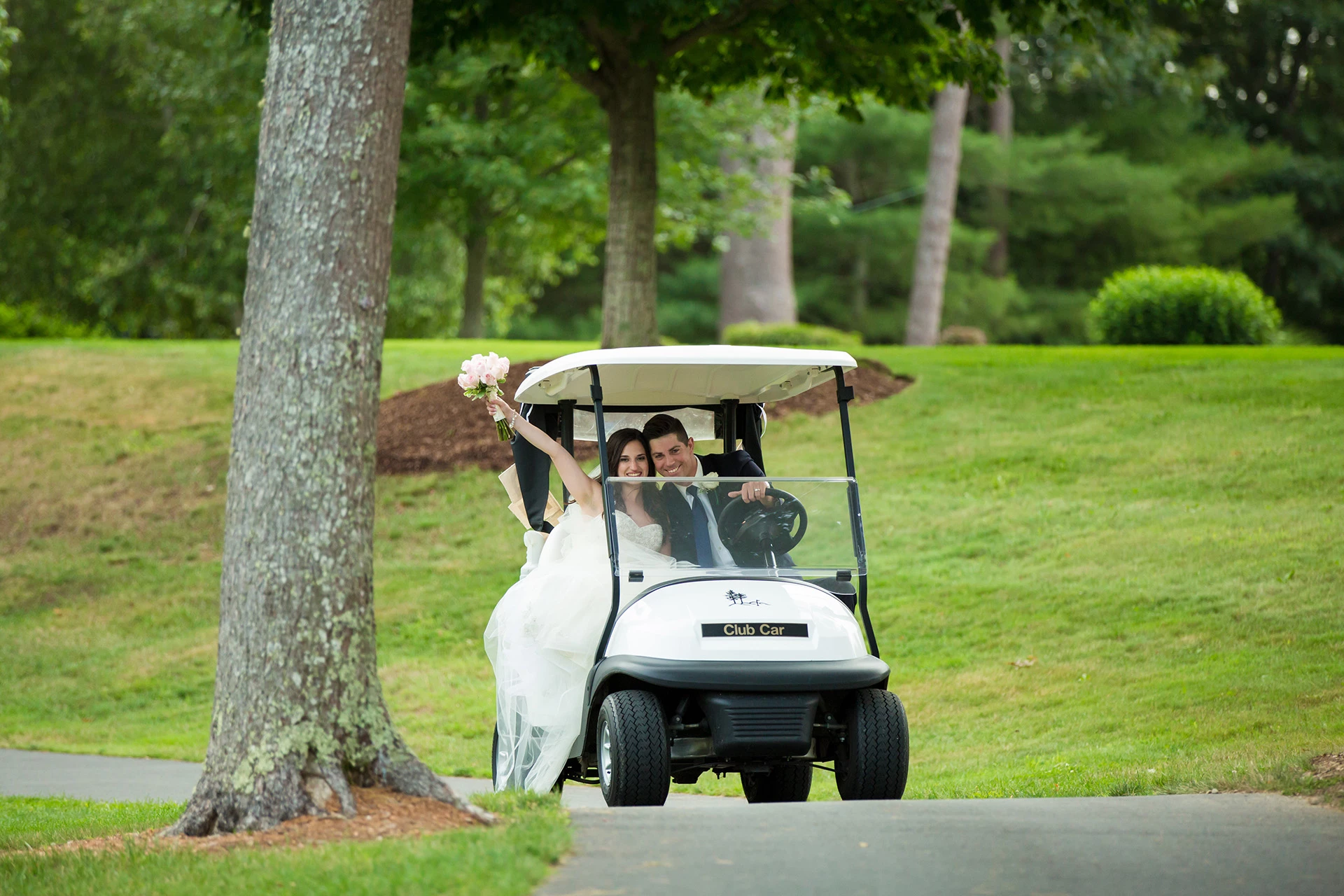 The Ridge Club - Bride and Groom in golf cart